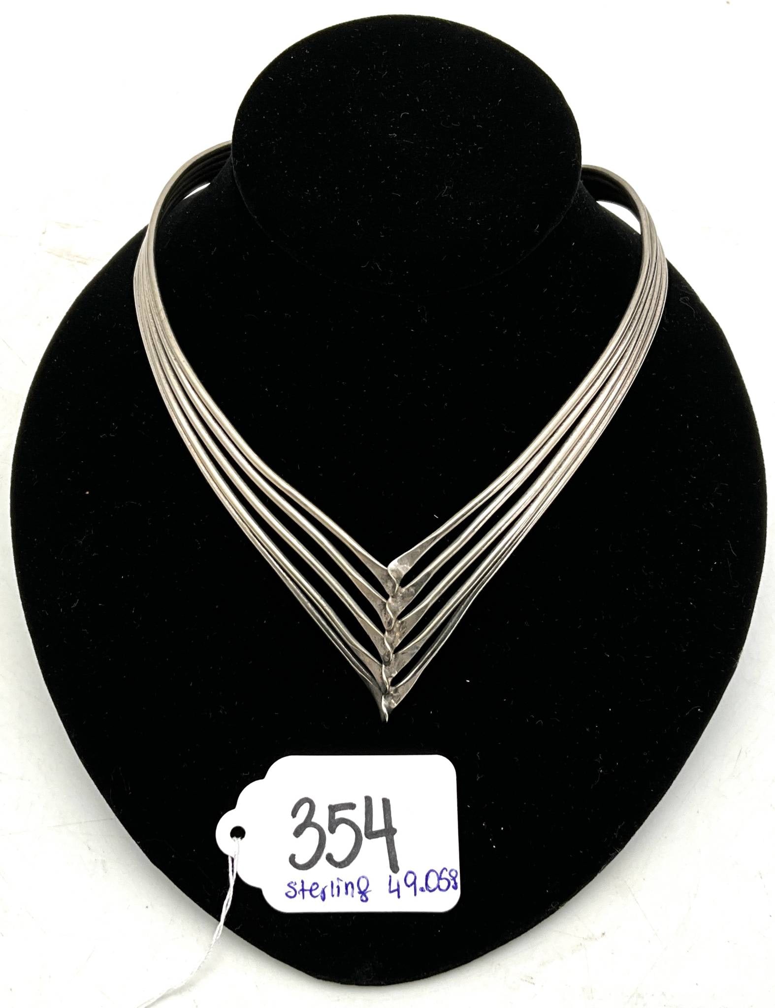 Sterling Silver Modernist Multi-Bar Necklace, 49.05 Grams: Elegant modernist necklace crafted from solid sterling silver with a total weight of 49.05 grams. Features a distinctive multi-bar V design converging at the center, showcasing clean lines and contemp