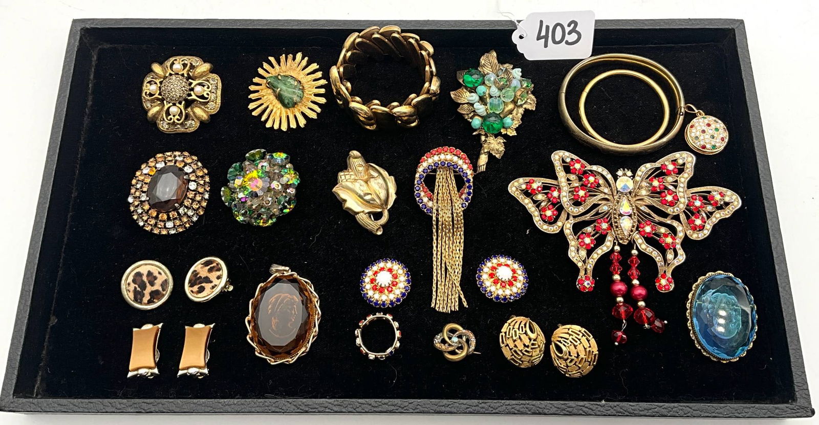 Costume Jewelry Including Jeanne, B.S.K., and Alice Caviness: Vintage costume jewelry featuring various makers such as Jeanne, B.S.K., Alice Caviness, and others. Includes brooches, bracelets, earrings, and a variety of decorative items, showcasing designs with