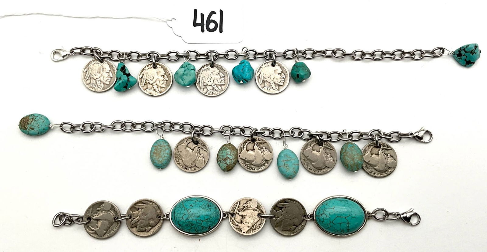 Buffalo Nickel and Turquoise Charm Bracelets, 6 to 8 Inches Long: Three charm bracelets featuring Buffalo nickels and turquoise accents. The bracelets measure 6 to 8 inches in length and are not made of sterling silver. Each bracelet incorporates a combination of vi