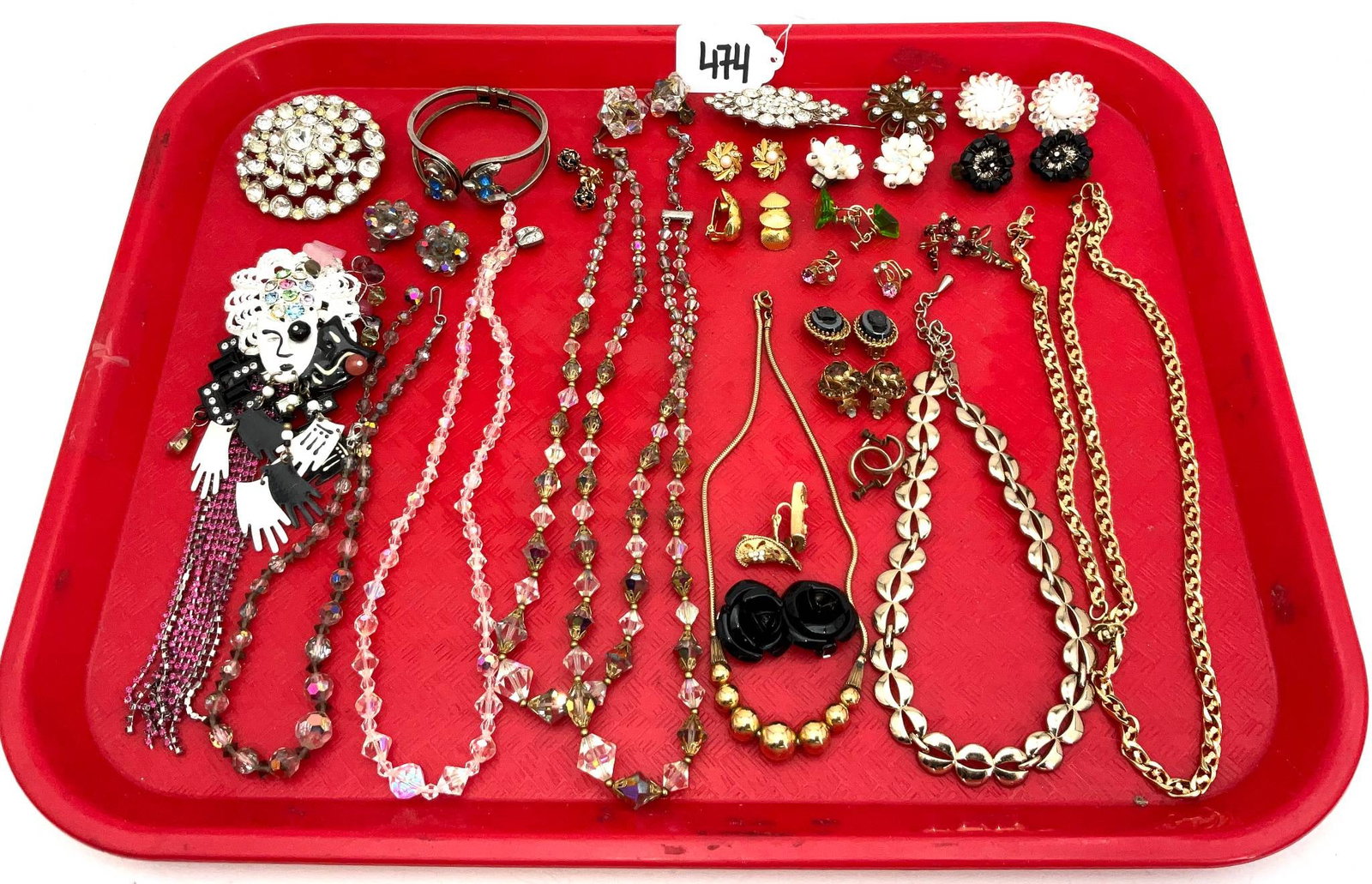 Costume Jewelry Including Signed Sarah Jane and Others: Costume jewelry featuring a variety of necklaces, earrings, bracelets, and brooches. Includes signed pieces by Sarah Jane and others. Highlights include crystal beaded necklaces, floral and enameled b