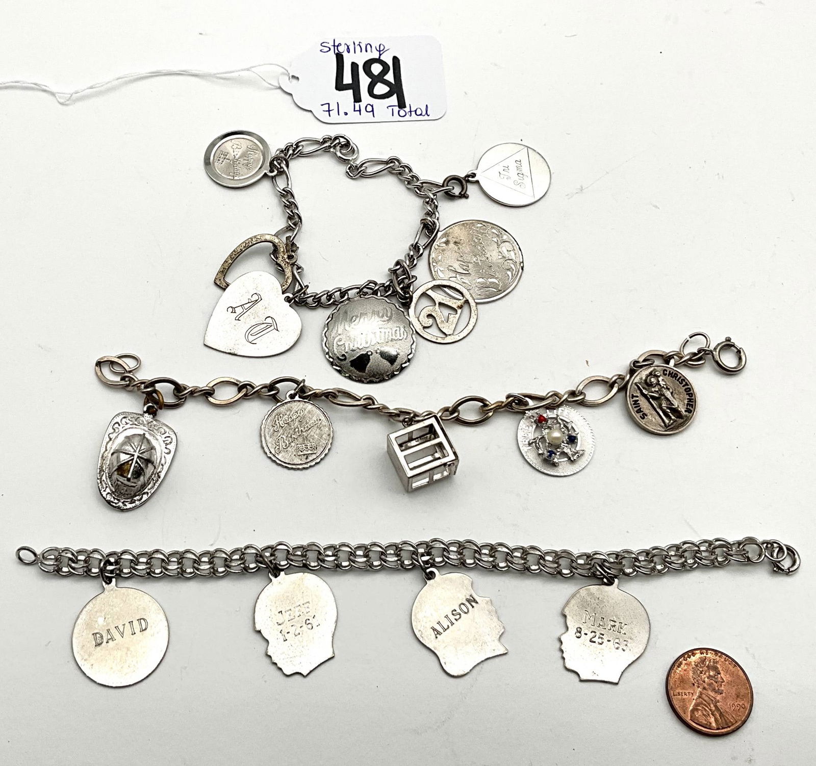Sterling Silver Charm Bracelets, 71.49 Grams, 6.5 Inches Long: Three sterling silver charm bracelets with a combined total weight of 71.49 grams. Each bracelet measures 6.5 inches in length. The charms include engraved names such as 'David' and 'Alison,' along wi