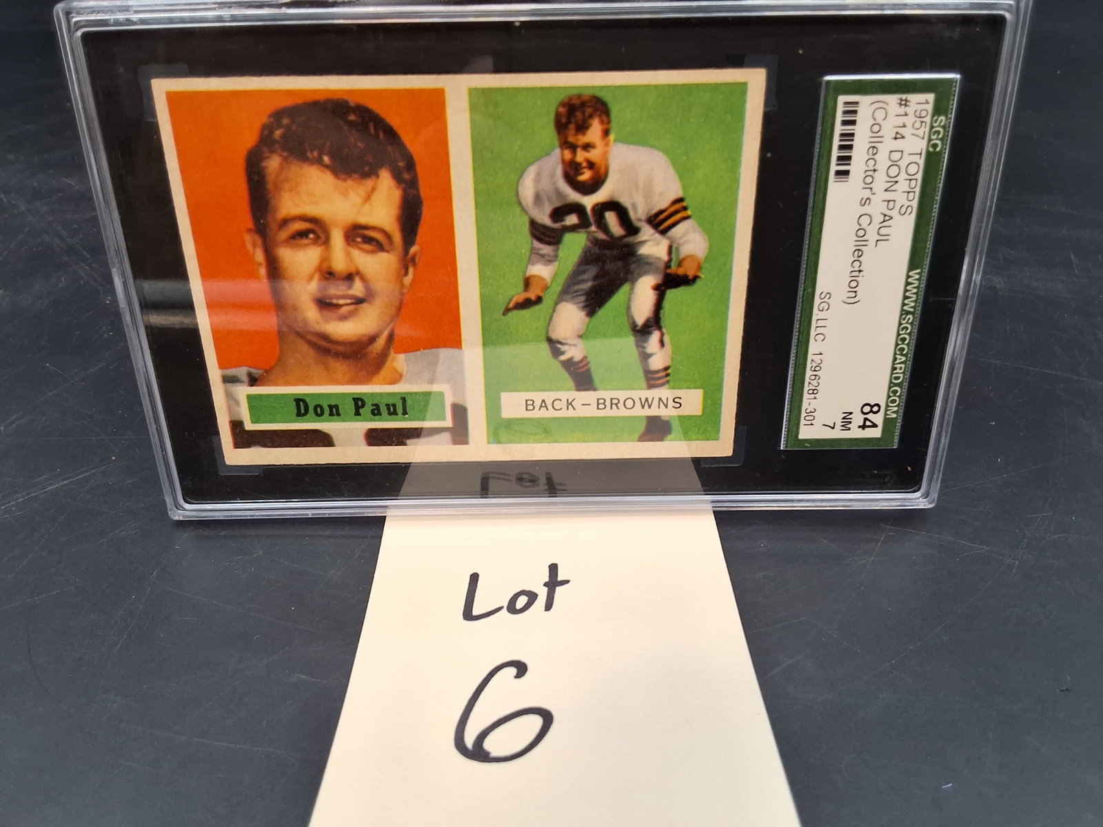 1957 Topps Don Paul SGC 7: 1957 Topps Don Paul SGC 7 Condition All property is sold in "as is" condition and all sales are final. Teel Auctions and its consignor make no representations or warranties, express or implied, with r