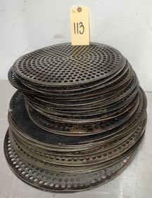 Stack of Perforated Pizza Trays, 12 to 15 Inch Diameter