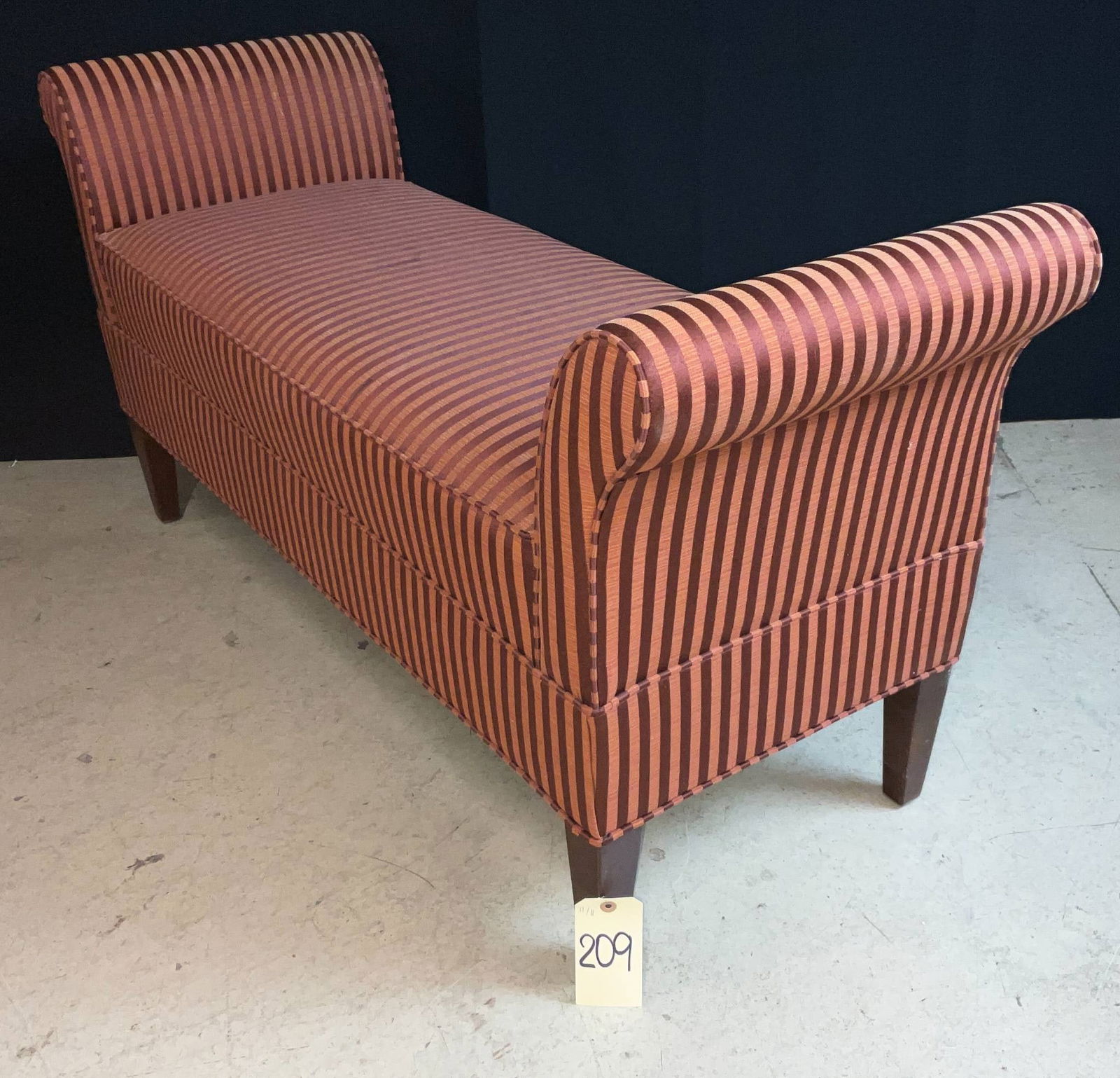 Fairfield Chair Company Upholstered Bench with Striped Fabric: Upholstered bench by Fairfield Chair Company, Lenoir, North Carolina. Measures 52 by 19 inches with a height of 26 inches. Features orange and brown striped fabric with rolled arms on both sides. Labe