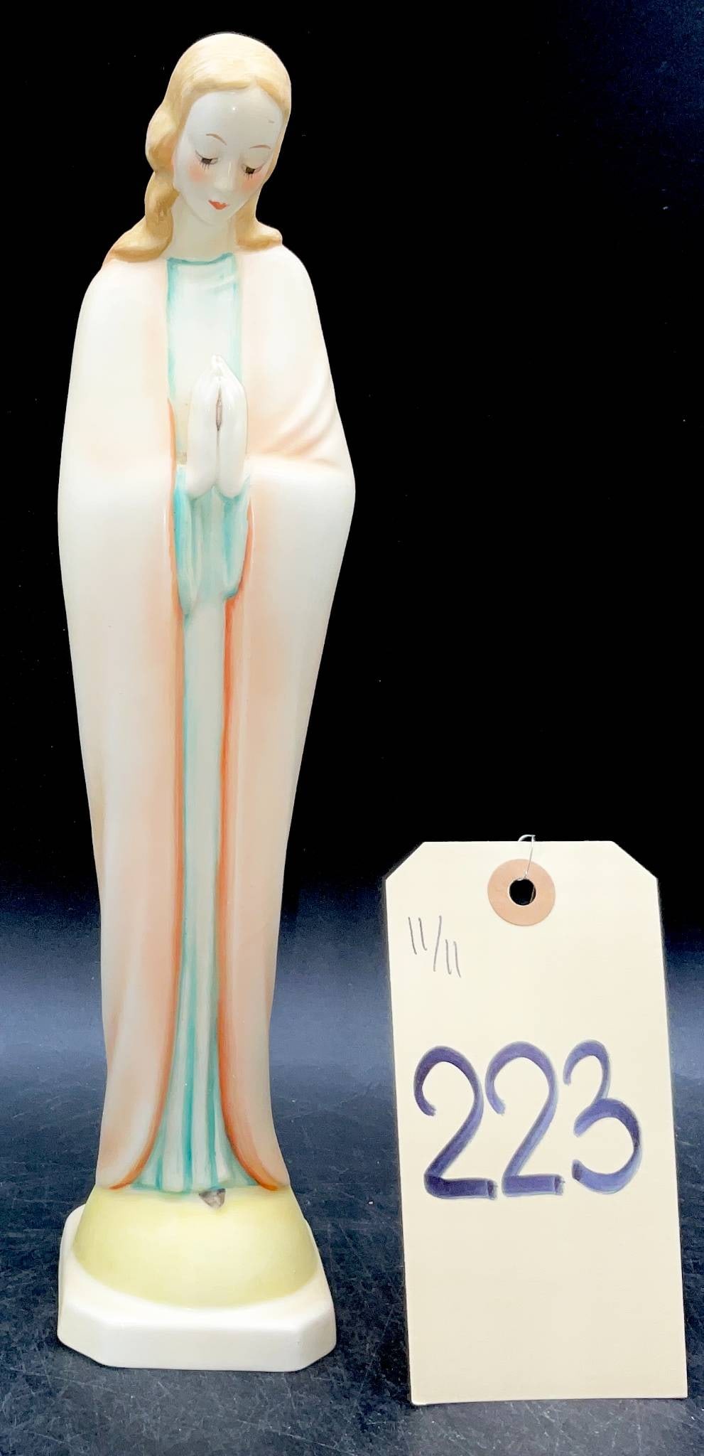 Goebel Figurine of Praying Woman, Western Germany, 11.5 Inches: Goebel porcelain figurine depicting a praying woman with hands clasped. Made in Western Germany, as marked on the underside. The figure stands 11.5 inches in height and features soft pastel tones with