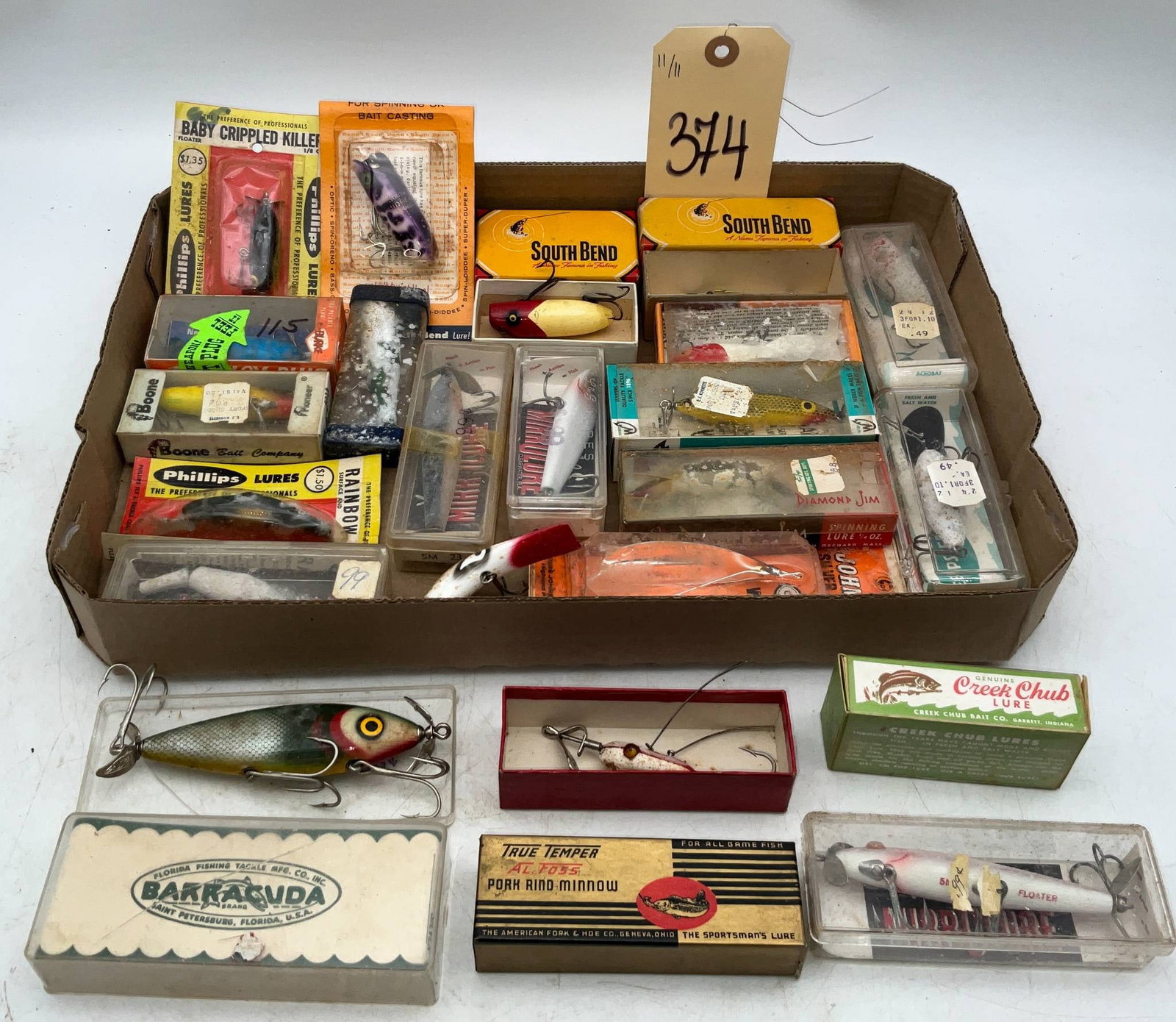 Fishing Lures from South Bend, Creek Chub, True Temper, Barracuda, and Others: Fishing lures, including examples from South Bend, Creek Chub, True Temper, Barracuda, and additional makers. Includes various styles and designs, some in original boxes with printed branding and artw
