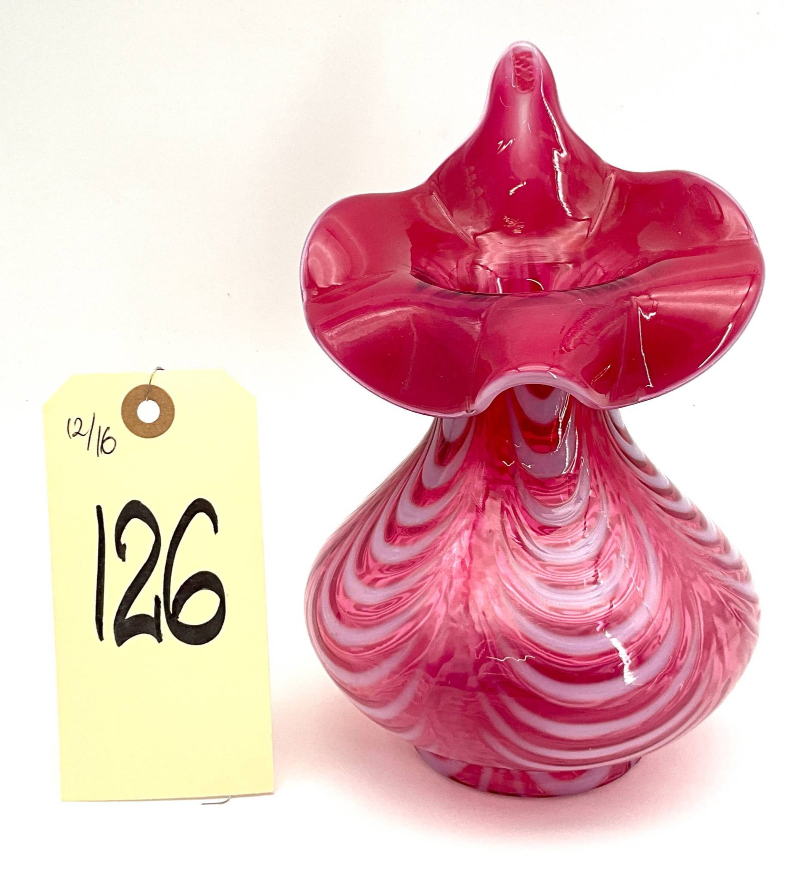 Handblown Pink Swirled Jack in the Pulpit Glass Vase: An 8-inch tall handblown jack in the pulpit glass vase featuring a vibrant pink and white swirled pattern. Designed with a dramatic flared and ruffled rim, the piece showcases the intricate craftsmans