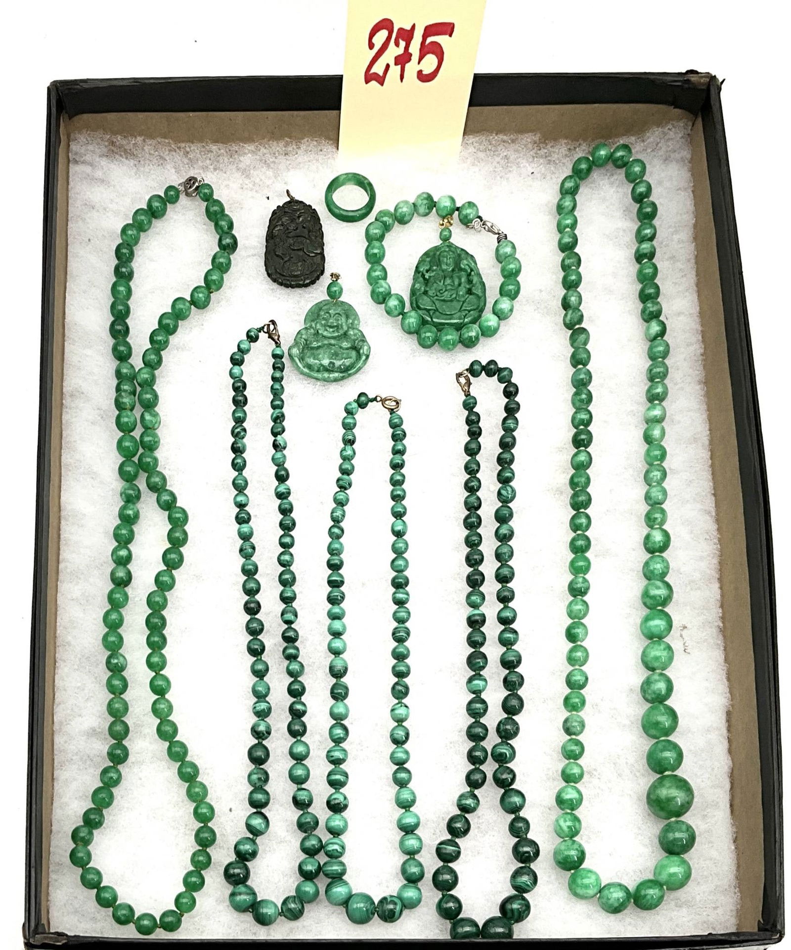 Malachite Jewelry Set Featuring Necklaces, Pendants, Ring, and Bracelet: Malachite jewelry collection including seven necklaces of varying bead sizes, two carved pendants (one with black malachite and the other in green malachite), a circular malachite ring, and a malachit