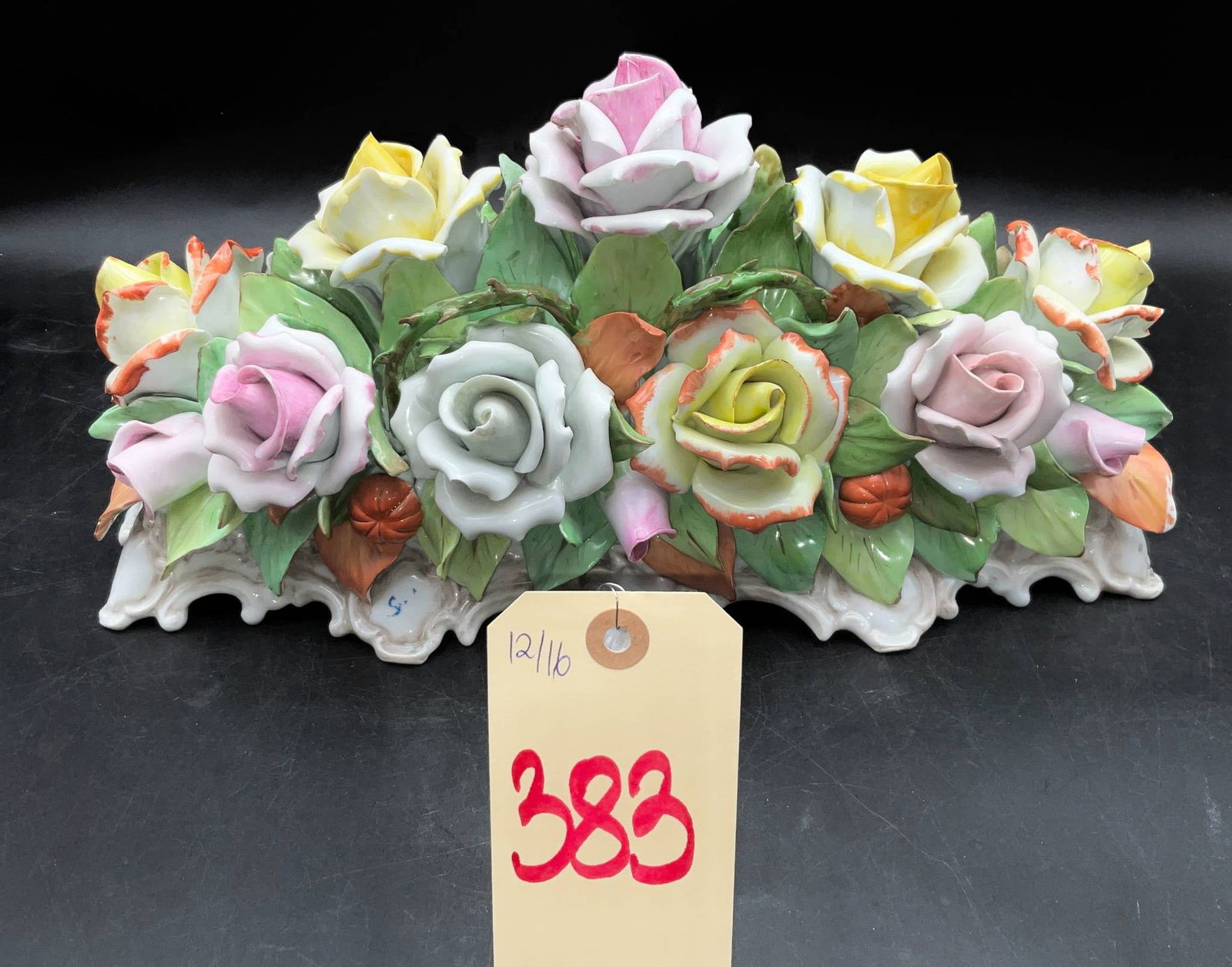 Capodimonte Porcelain Centerpiece With Floral Design, 16 x 7 x 8 Inches: Capodimonte porcelain centerpiece measuring 16 x 7 x 8 inches tall. Features an intricate floral design with various colorful roses and green leaves delicately handcrafted in porcelain. Notable for it