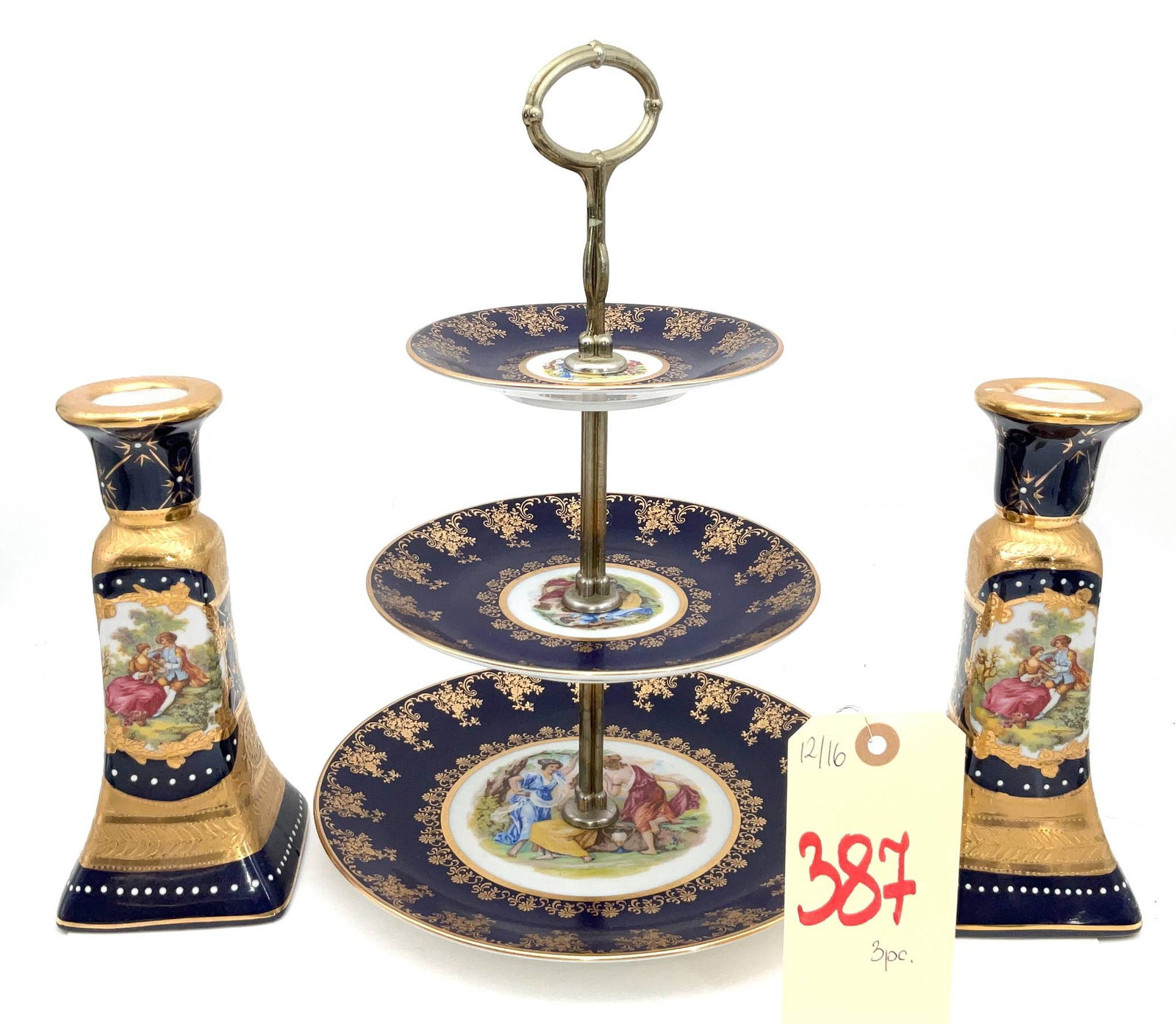 3-Piece Decorated Porcelain Tiered Dish and Candlesticks Set: Porcelain set including a three-tiered serving dish and a pair of candlesticks featuring intricate decorations. The tiered dish stands 13.5 inches tall and is constructed with a metal center post and