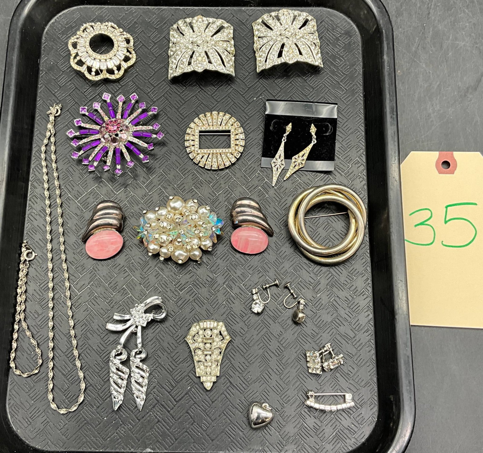Tray Lot of Jewelry Featuring Holfast Pieces and Others: A varied tray lot of jewelry including brooches, earrings, pendants, bracelets, rings, and other accessories. Notable items include Holfast-marked silver-tone pieces and adornments with faux pearls, r