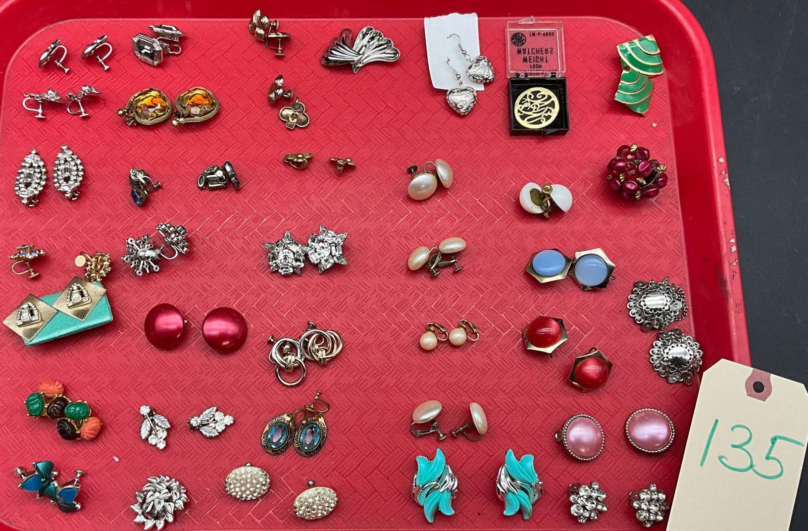 Vintage and Mid-Century Clip-On and Screw-Back Earrings: Earrings featuring vintage and mid-century designs with clip-on and screw-back closures. Includes pairs with various materials such as rhinestones, faux pearls, enamel, and metal finishes. Notable pie