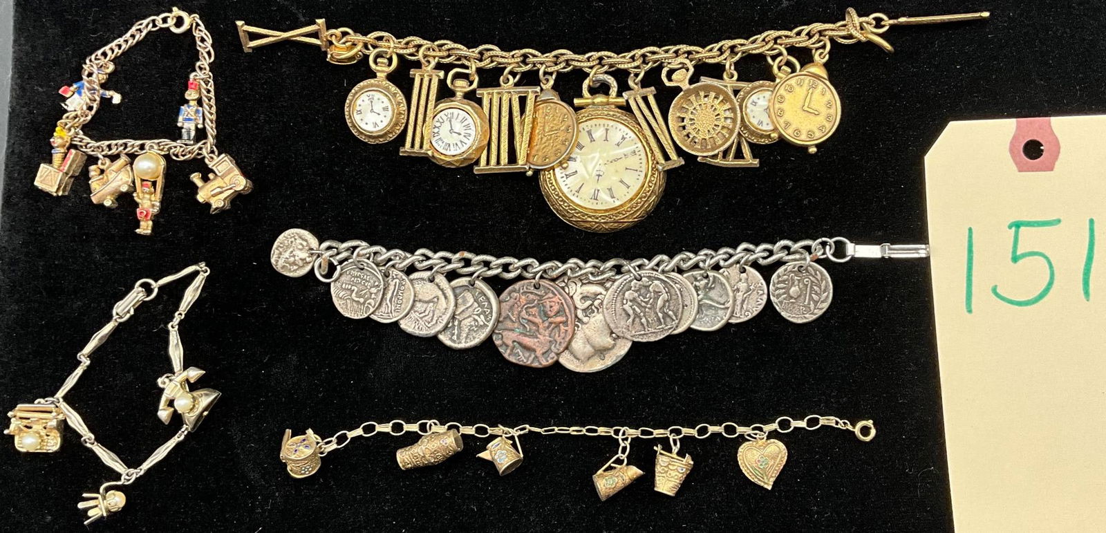 5 Assorted Charm Bracelets Featuring Coins, Clocks, and Novelty Charms: Five charm bracelets showcasing various themes and materials. Includes a gold-tone bracelet with clock face and Roman numeral charms, a silver-tone bracelet with coin charms depicting various designs,