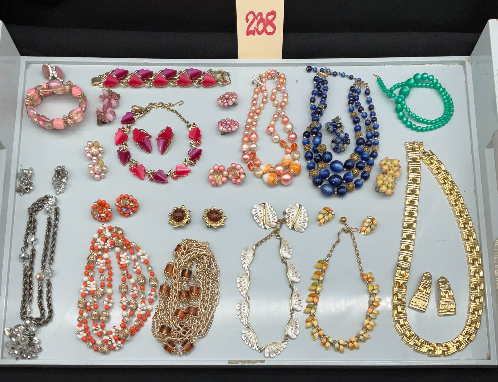 Vintage Bracelets, Earrings, and Necklaces, Marked Japan, Schrager, and More: Vintage costume jewelry featuring bracelets, earrings, and necklaces. Some pieces are marked Japan, Schrager, and others. The assortment includes necklaces made of gold-tone metal, beads in vibrant co