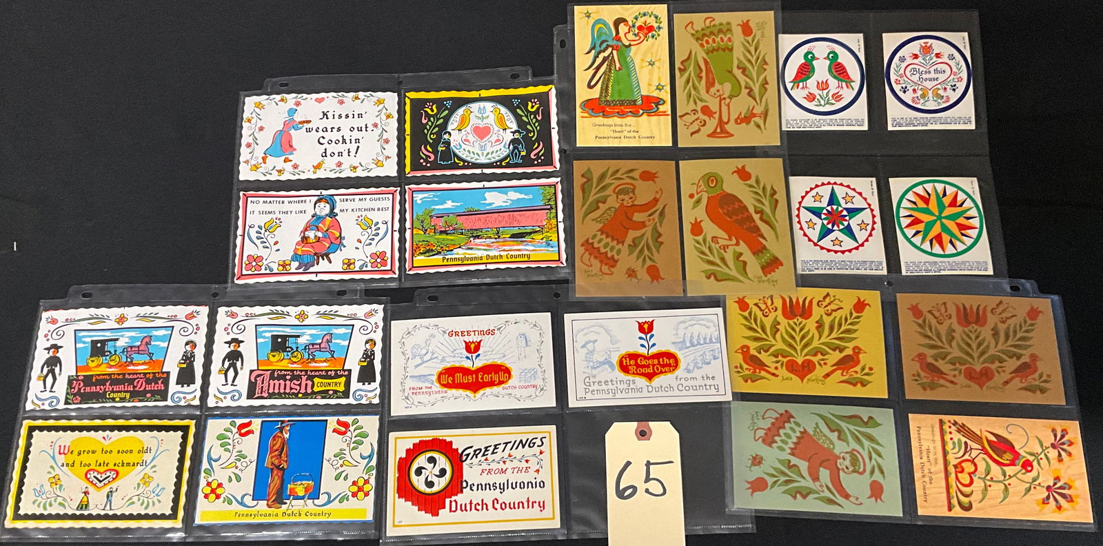 Lee Mertz. Collection of Pennsylvania Dutch Folk Art Postcards and Ephemera.: A substantial collection of vintage postcards and paper ephemera featuring vibrant Pennsylvania Dutch folk art motifs, including Fraktur designs, hex signs, birds, tulips, and Amish figures. The items