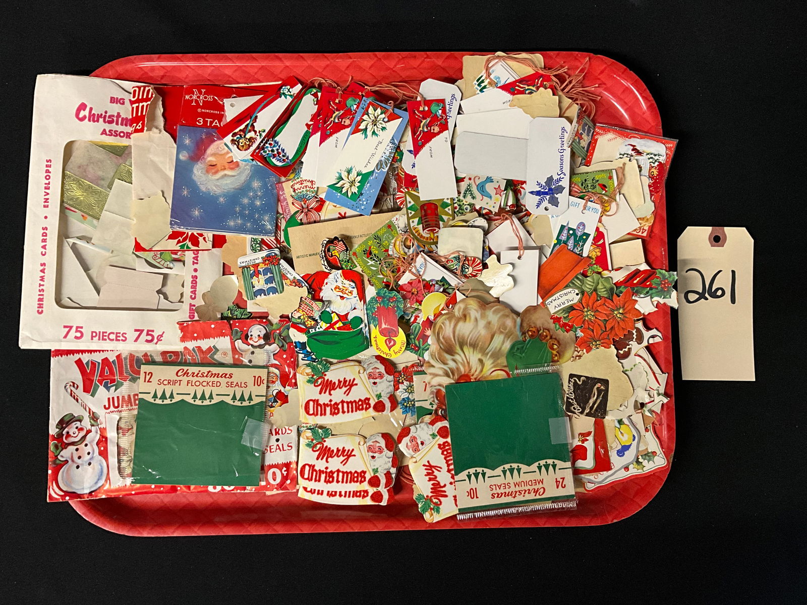 Vintage Mid-Century Christmas Ephemera Assortment, 1950s-1960s: This lot consists of various printed holiday paper items including gift tags, adhesive seals, and small greeting cards from the mid-20th century. The collection features iconic commercial illustration