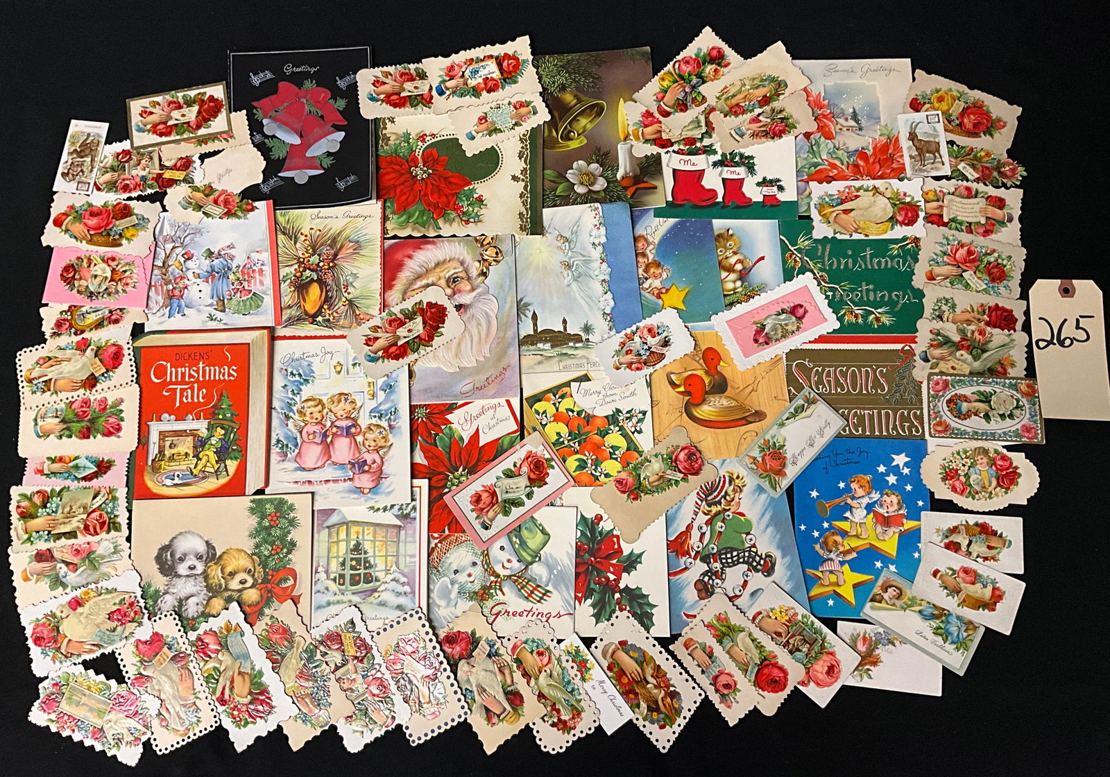 Vintage Christmas Ephemera and Greeting Card Collection, c. 1880s-1960s: This collection of approximately 75 to 85 pieces includes Victorian die-cut scraps, trade cards, and mid-century folding cards dating from the 1880s to the 1960s. These printed items, rather than real