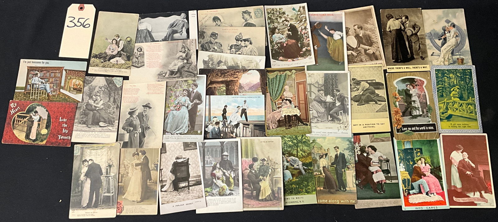 Romantic and Humorous Courting Postcards: This lot contains vintage postcards from the Golden Age of postcards, circa 1905 to 1920. The collection features a mix of hand-tinted real photo postcards, monochrome studio portraits, and illustrate