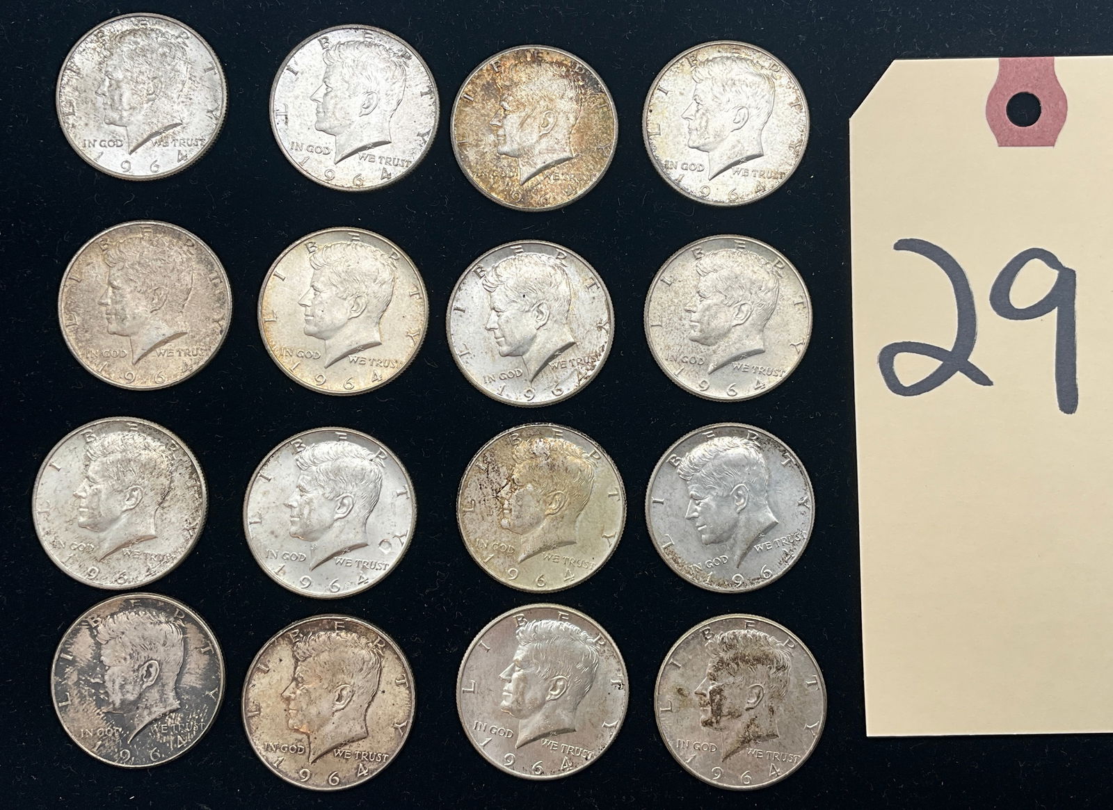 US 1964 Half Dollars, 90% Silver, KM-202: KM-202. Designer: Gilroy Roberts and Frank Gasparro. Philadelphia Mint. Kennedy obverse / Presidential Seal reverse. A Collection of Coins featuring Kennedy Half Dollars composed of 90% silver materia