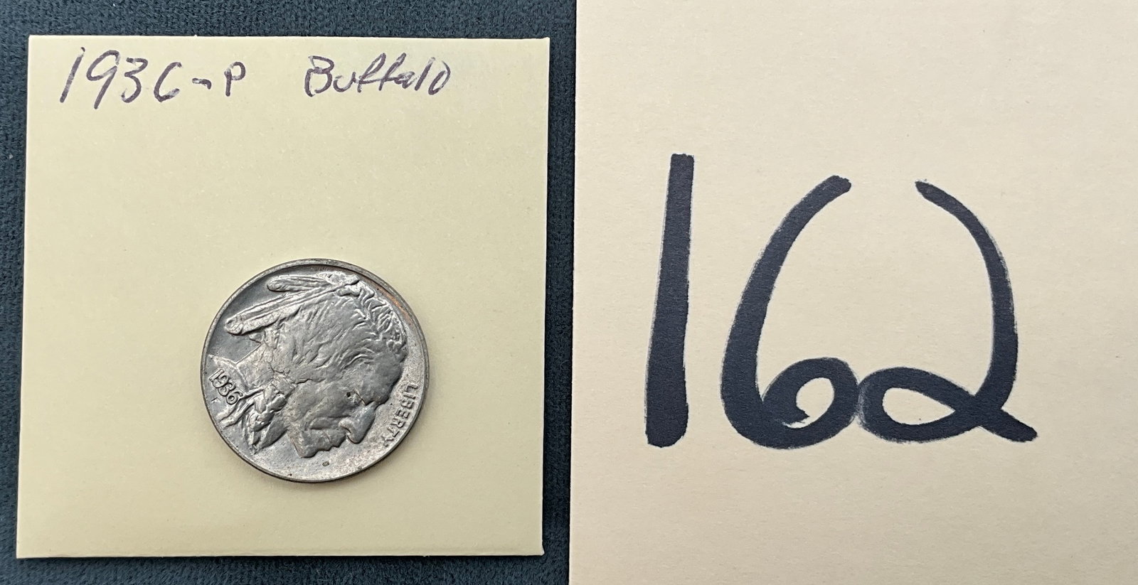 US 1936 Five Cents, Cupro-Nickel, KM-134: Catalog number KM-134. Designed by James Earle Fraser. Struck at the Philadelphia Mint with no mint markings found below the denomination. This specimen is a Buffalo nickel type, specifically the
