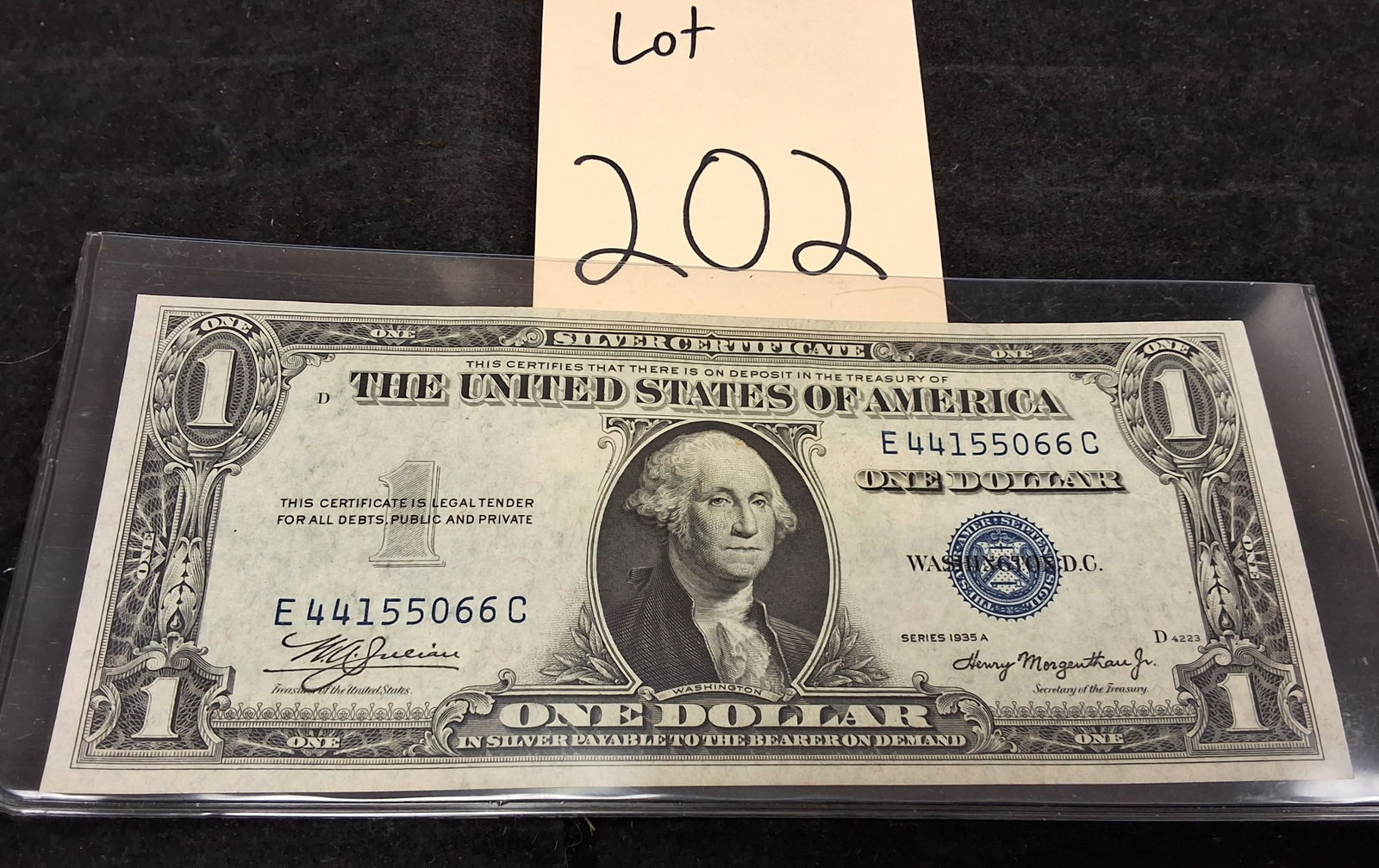 US 1935 A $1 Silver Certificate, Paper, Fr. 1608: Catalog number Friedberg 1608. Signatures of W.A. Julian and Henry Morgenthau Jr. Washington portrait / Great Seal reverse. Serial number E 44155066 C printed in blue. Obverse plate D 4223; reverse pl