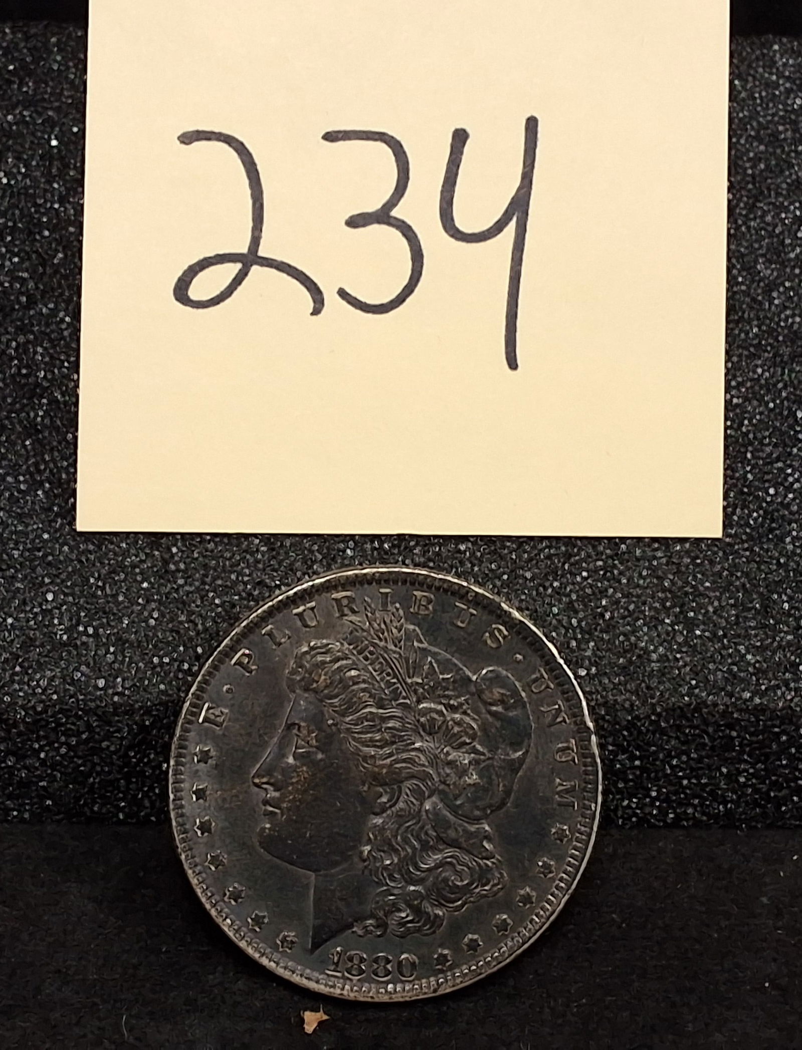 US 1880 Morgan Dollar, Silver, KM-110: KM-110. Designer: George T. Morgan. Struck at the Philadelphia Mint. Liberty Head / Eagle. This 1880 Philadelphia issue had a total mintage of 12,600,000 pieces. Condition All property is sold in "as