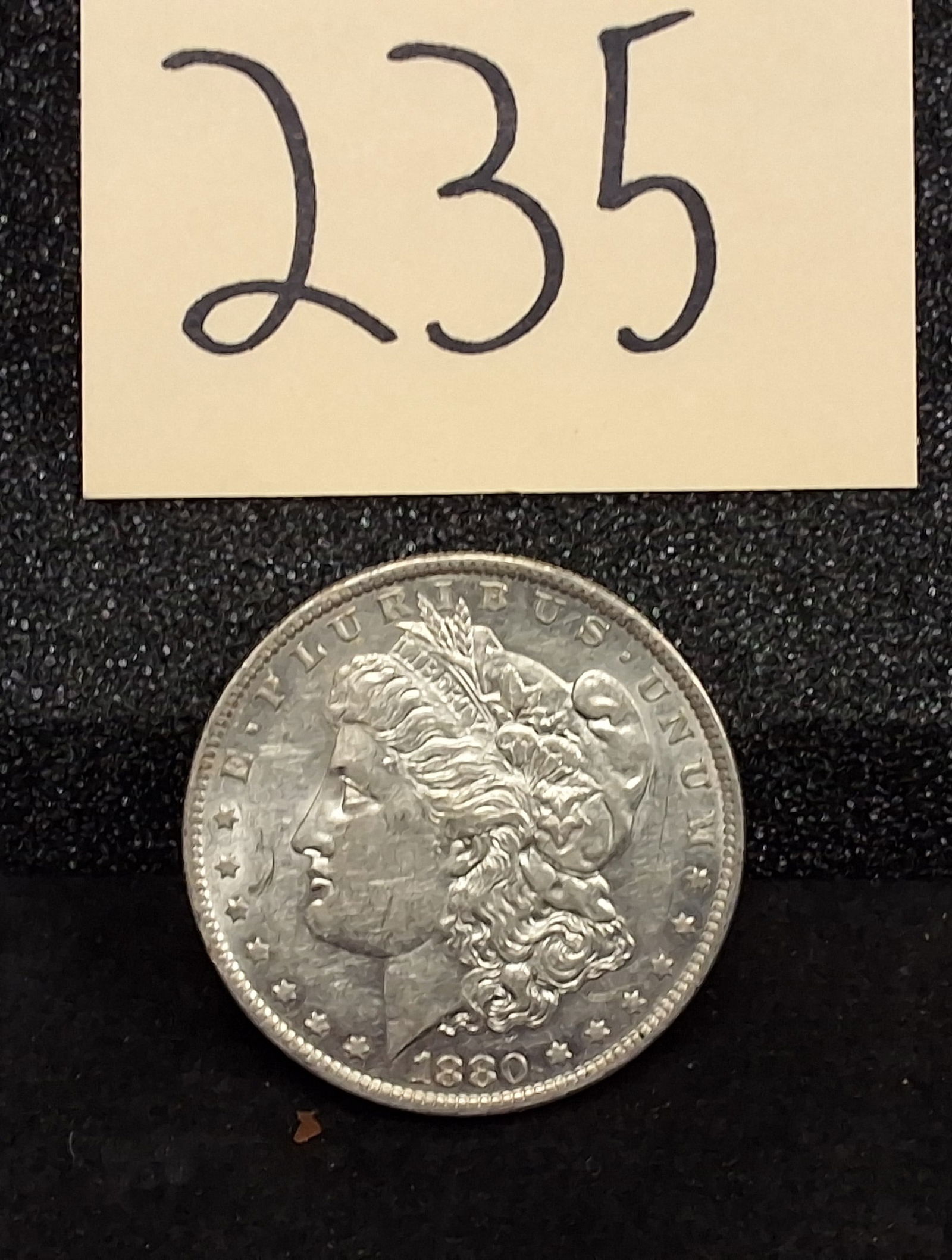 US 1880-O Morgan Dollar, Silver, KM-110: Catalog: KM-110. Designer: George T. Morgan. Mint mark: O, New Orleans Mint. Design type: Morgan Liberty / Eagle. The New Orleans Mint struck 5,305,000 silver dollars in 1880. Condition All property i