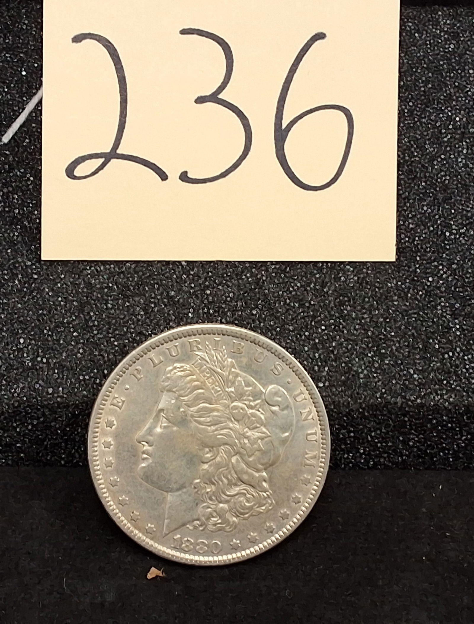 US 1880 Morgan Silver Dollar, KM-110: Catalog Number: KM-110. Designer: George T. Morgan. Mint: Philadelphia (no mint mark). Design Type: Liberty Head / Eagle. Historical Note: This 1880 p morgan silver dollar was part of a mintage of 12,