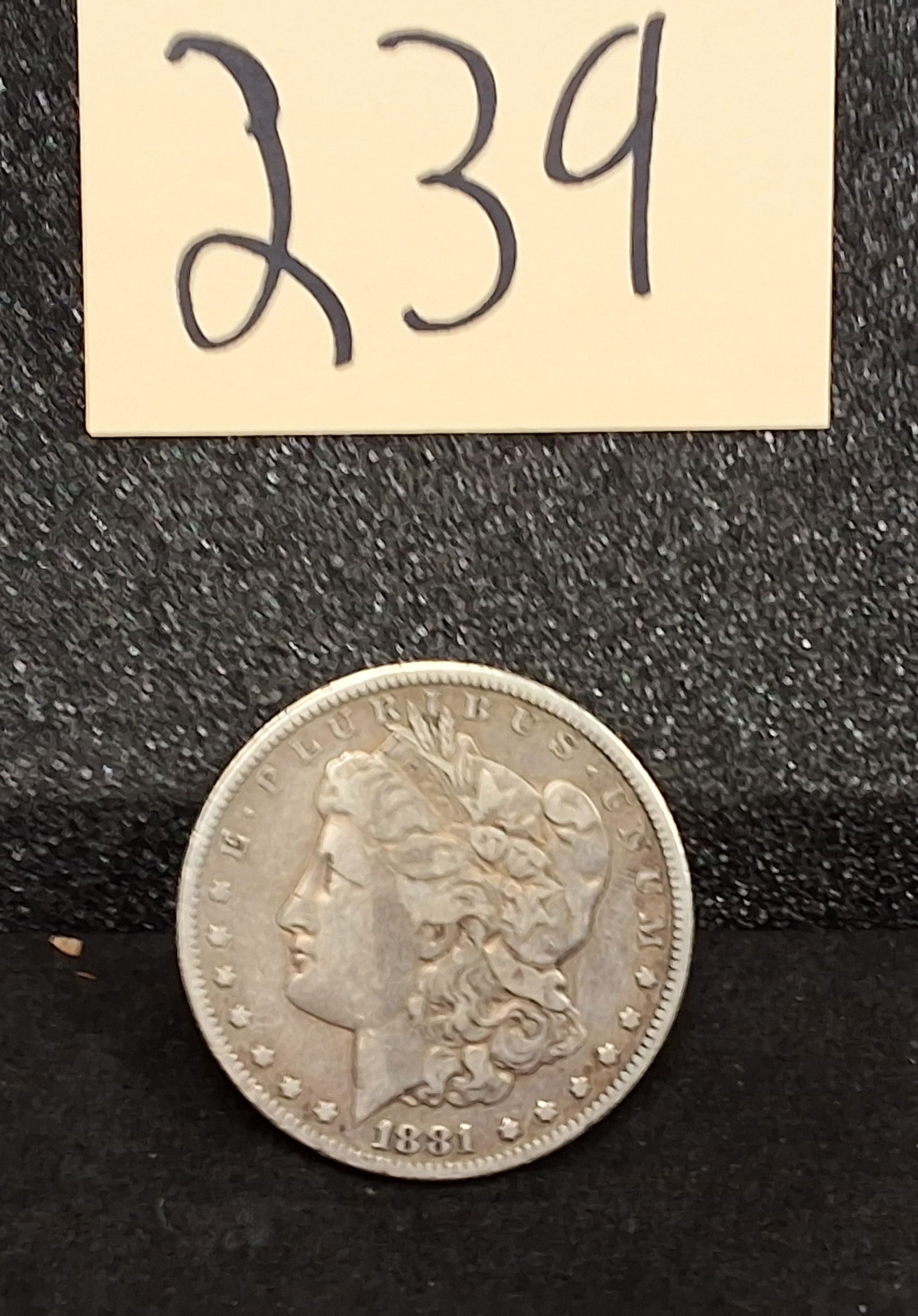 US 1881 Morgan Dollar, Silver, KM-110: Catalog number KM-110. Designer George T. Morgan. Philadelphia Mint. Liberty obverse / Eagle reverse. Condition All property is sold in "as is" condition and all sales are final. Teel Auctions and its