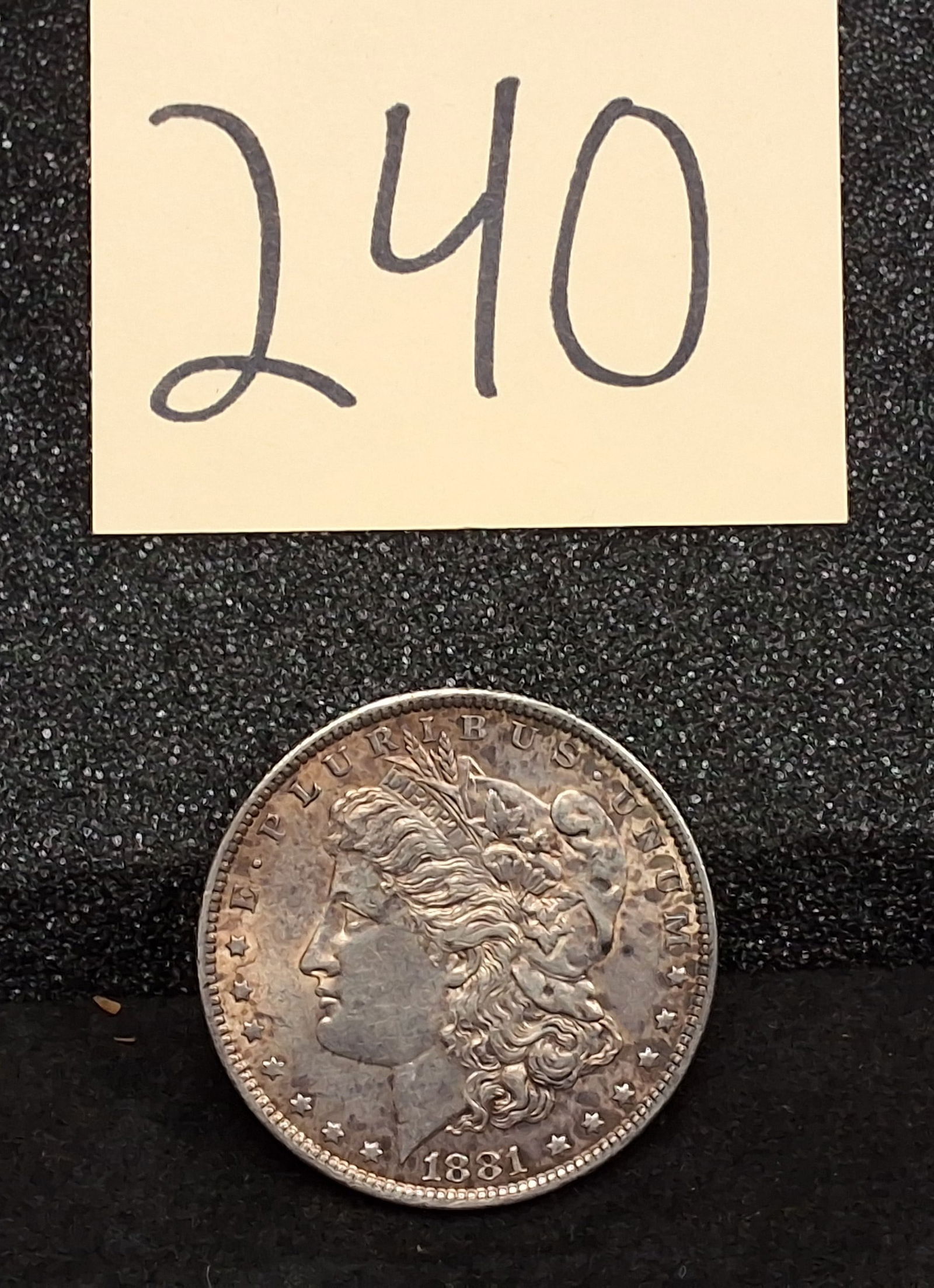 US 1881 One Dollar, Silver, KM-110: KM-110. Designer: George T. Morgan. Philadelphia Mint. Morgan head / Eagle reverse. Total mintage for this date and mint was 9,163,000. Condition All property is sold in "as is" condition and all sale