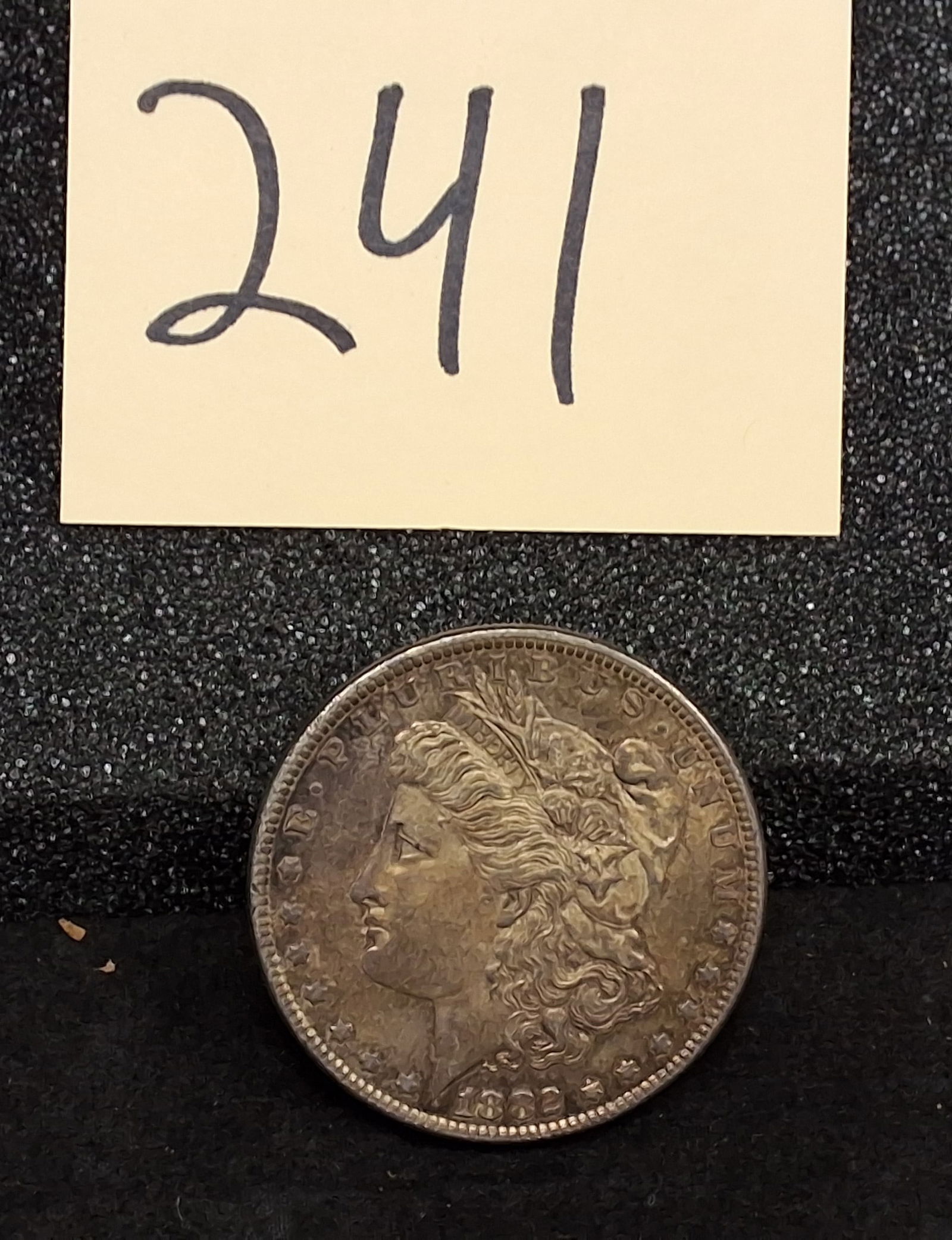 US 1882 Morgan Dollar, Silver, KM-110: KM-110. Designer: George T. Morgan. Philadelphia Mint. Morgan obverse / Eagle reverse. This date is a high-mintage issue with over 11 million pieces struck at the Philadelphia Mint.ConditionAll