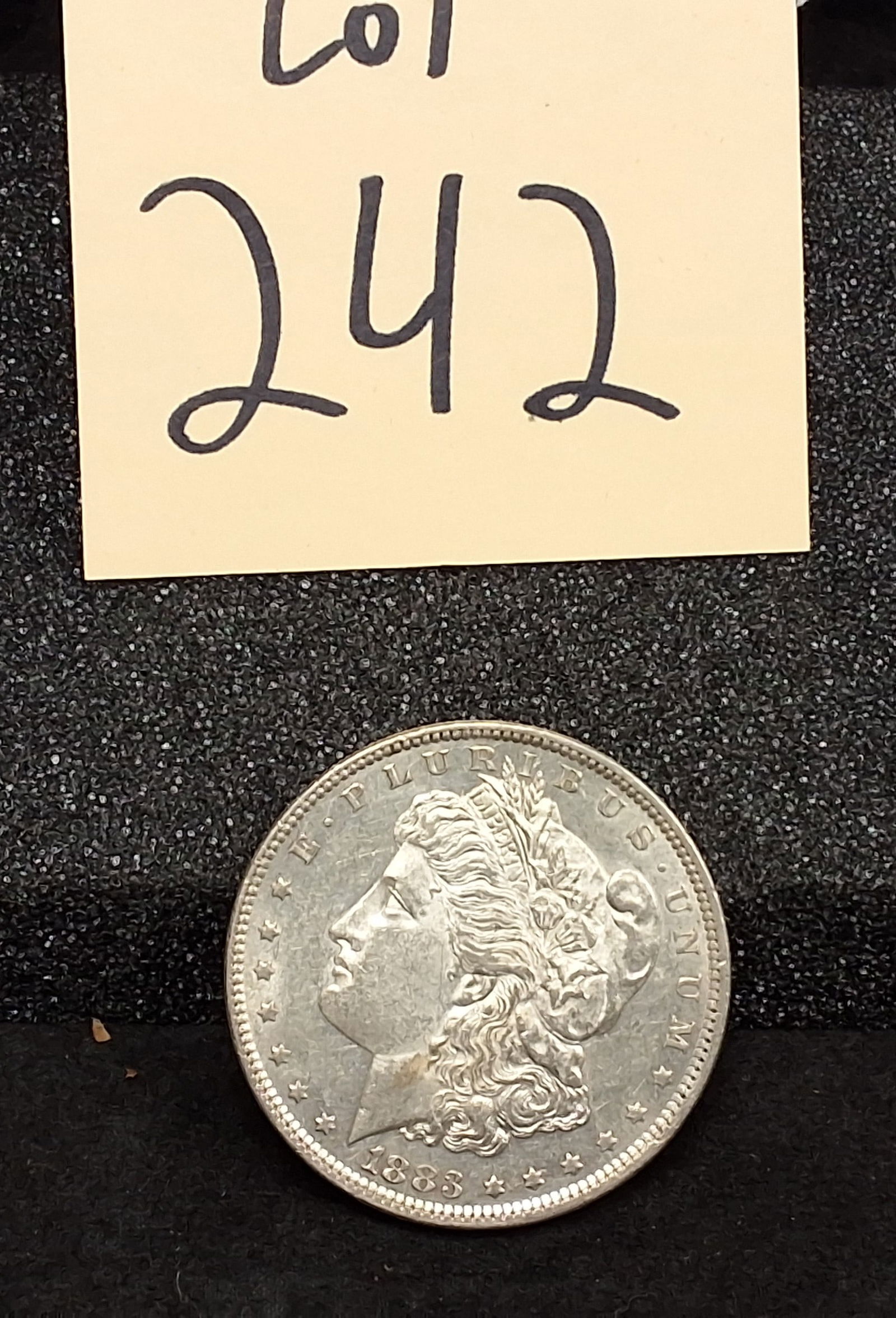US 1883 Morgan Dollar, Silver, KM-110: Catalog number: KM-110. Designer: George T. Morgan. Minted at the Philadelphia Mint. Design type: Liberty head / Eagle. Mintage: 12,290,000. Condition All property is sold in "as is" condition and all
