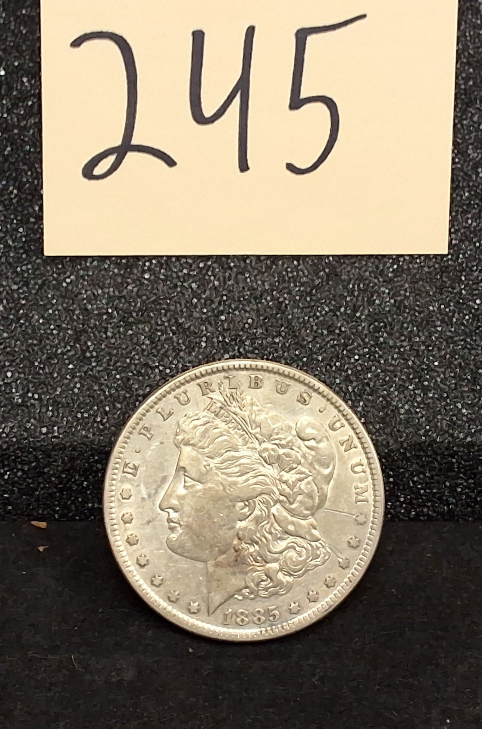 US 1885 One Dollar, Silver, KM-110: Catalog number KM-110. Designer George T. Morgan. Philadelphia Mint. Morgan Liberty / Eagle. Condition All property is sold in "as is" condition and all sales are final. Teel Auctions and its consigno