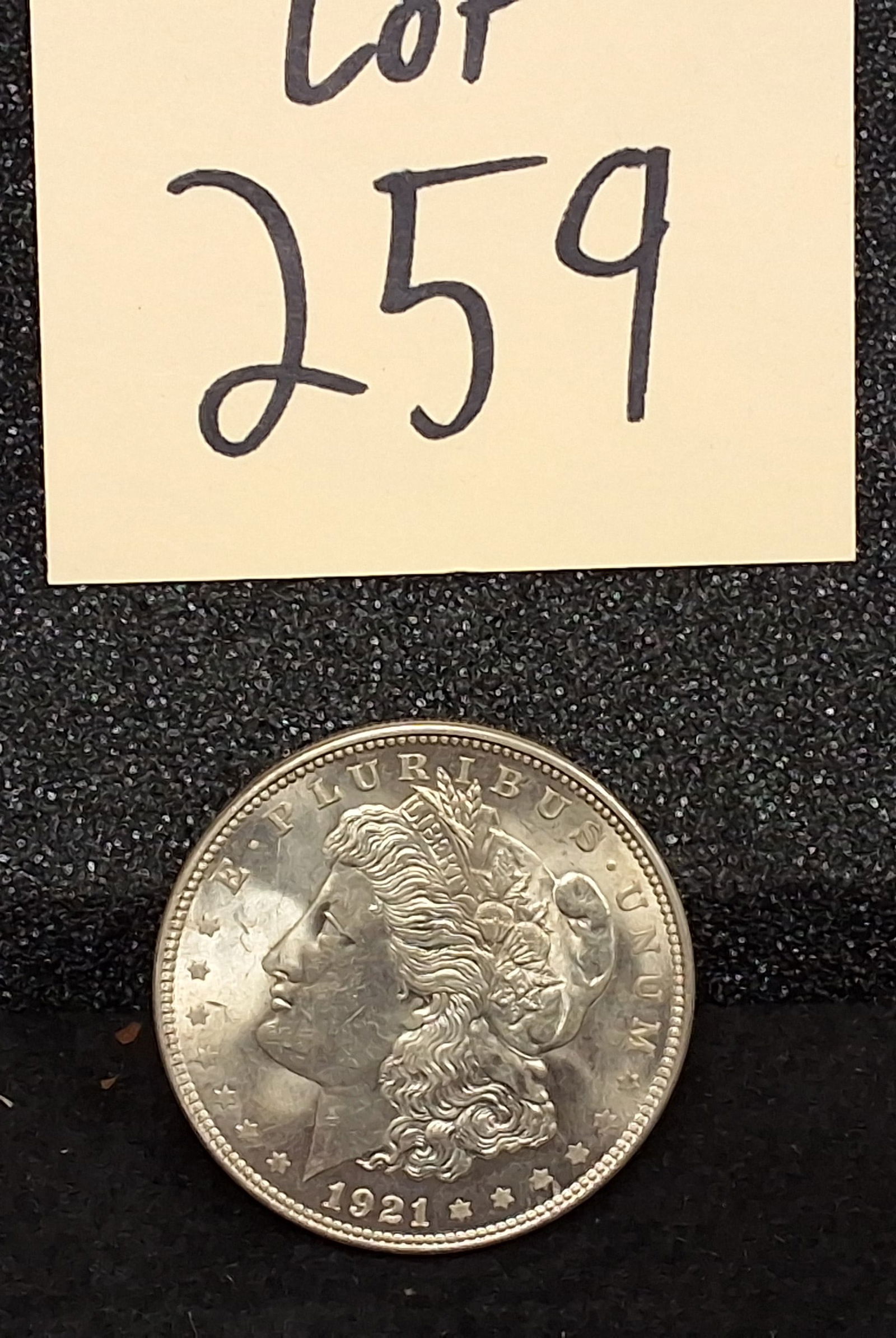 US 1921 Morgan Dollar, Silver, KM-110: Catalog number KM-110. Designer George T. Morgan. Struck at the Philadelphia Mint. Morgan obverse / Eagle reverse. This date represents the final year of the Morgan dollar series following a