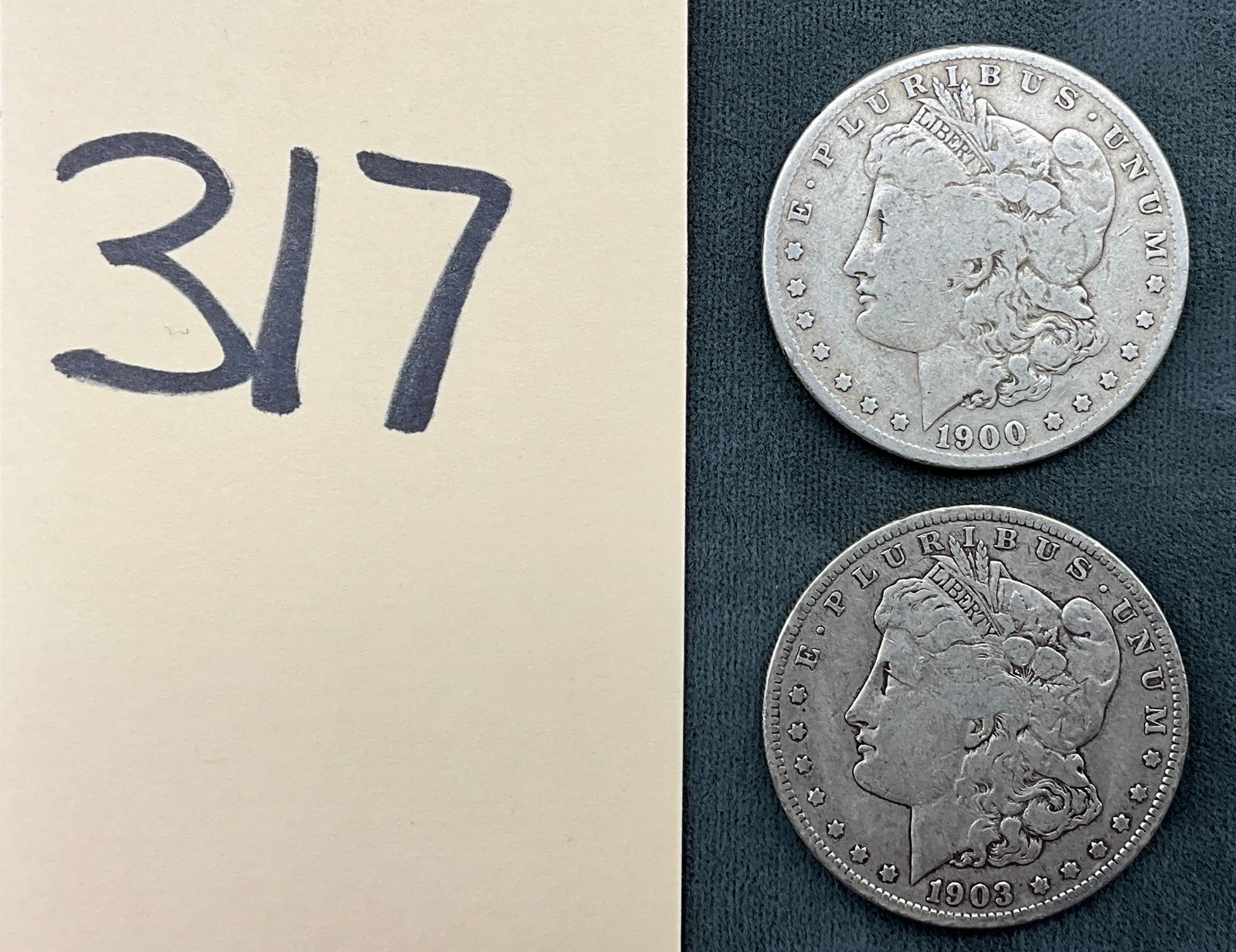 A Pair of US 1900-S and 1903-S Morgan Silver Dollars, KM-110: This pair of US Morgan silver dollars includes the 1900-S and 1903-S issues, both containing 90% silver. Each coin displays the S mint markings for the San Francisco Mint on the reverse. The 1903-S is
