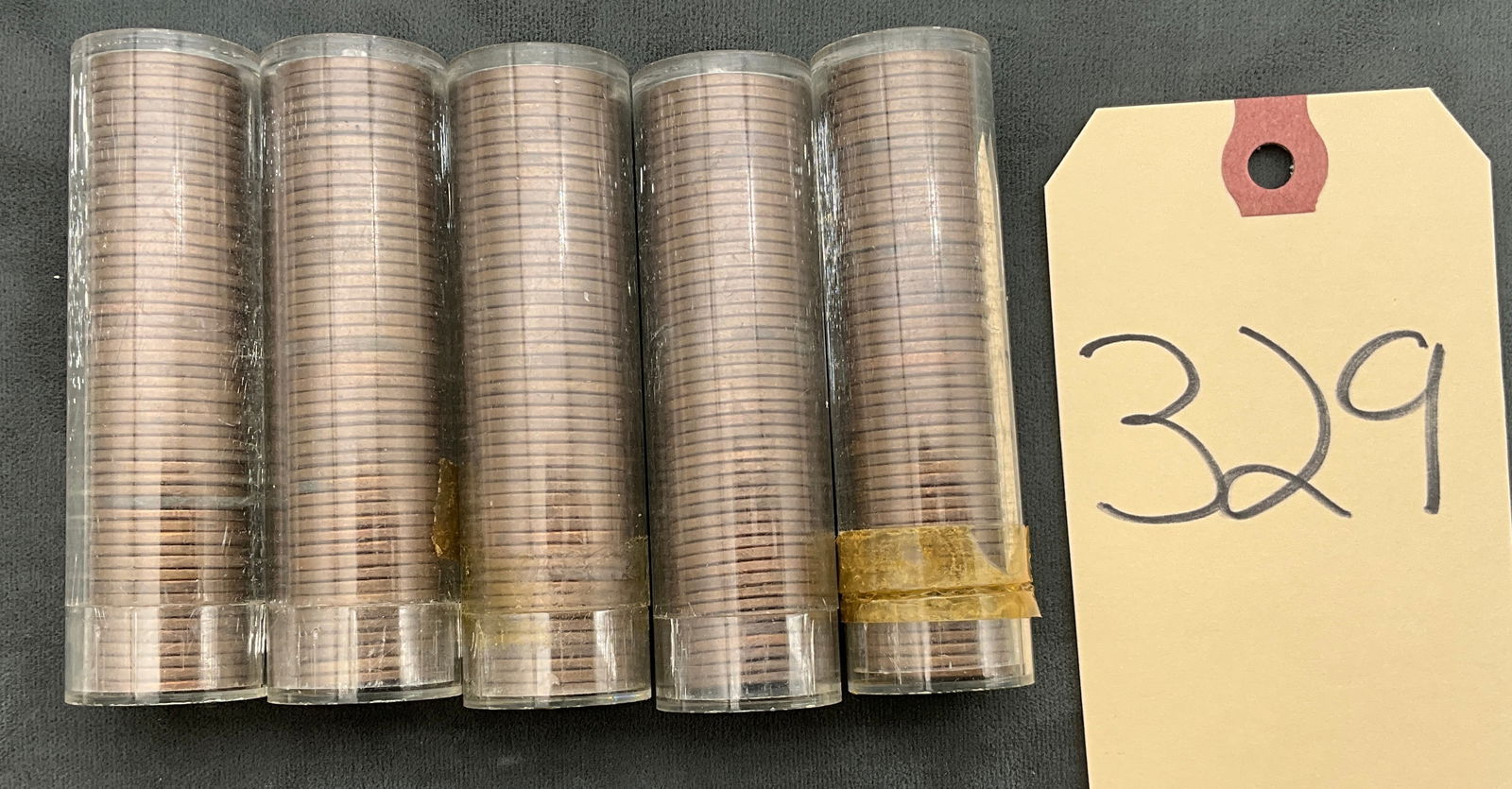 US 1944-1957 Lincoln Wheat Cents, Copper, KM-132: A collection of US Lincoln Wheat cents (KM-132) housed in five H.E. Harris & Co. plastic tubes. The lot includes various dates ranging from 1944 to 1957 with a visible D mint marking noted on the 1947