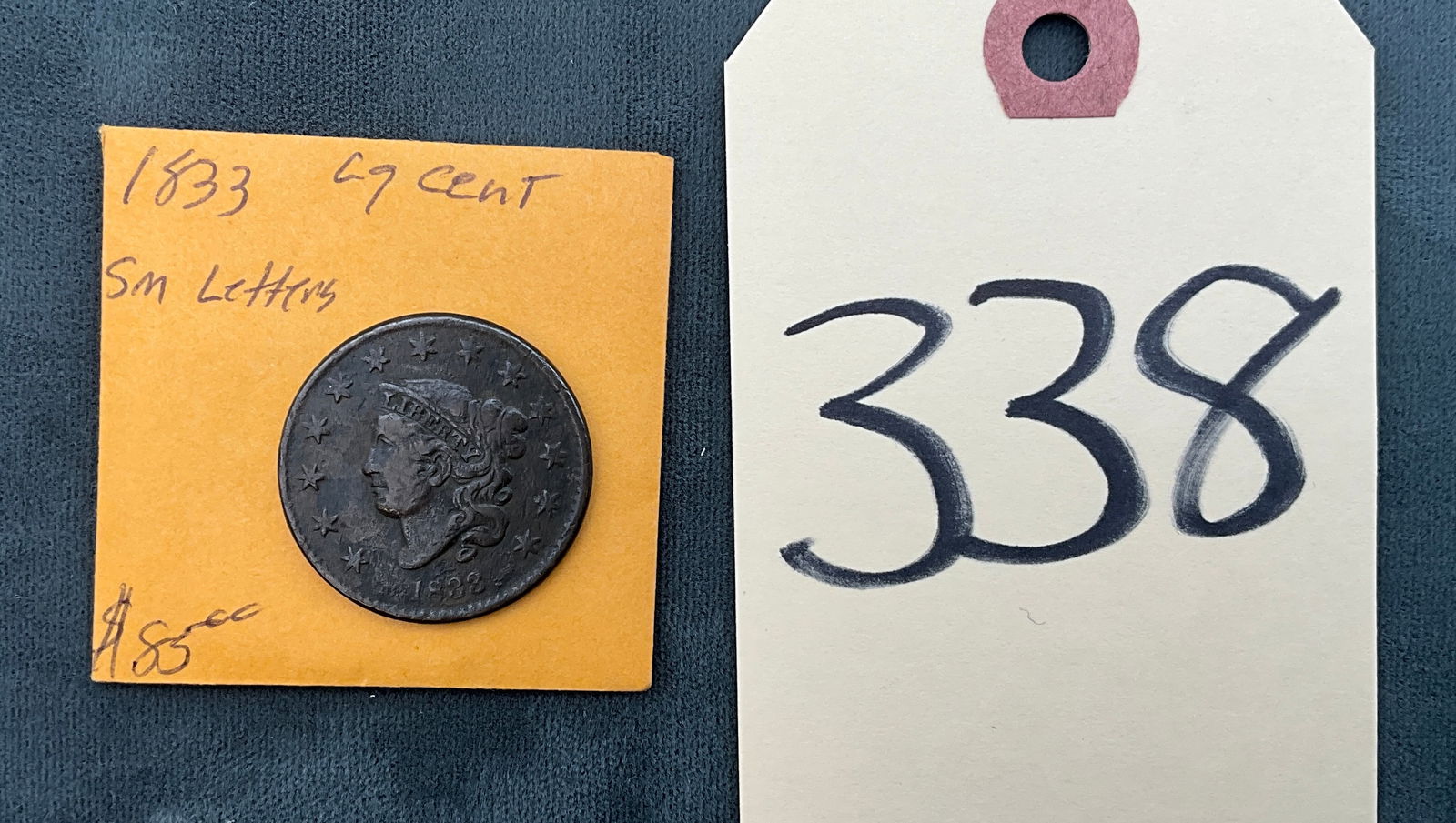 US 1833 Large Cent, Copper, KM-45: This US 1833 Large Cent is the Small Letters variety, cataloged as KM-45 and designed by William Kneass. Struck at the Philadelphia Mint, the coin features no mint markings and contains no silver. The