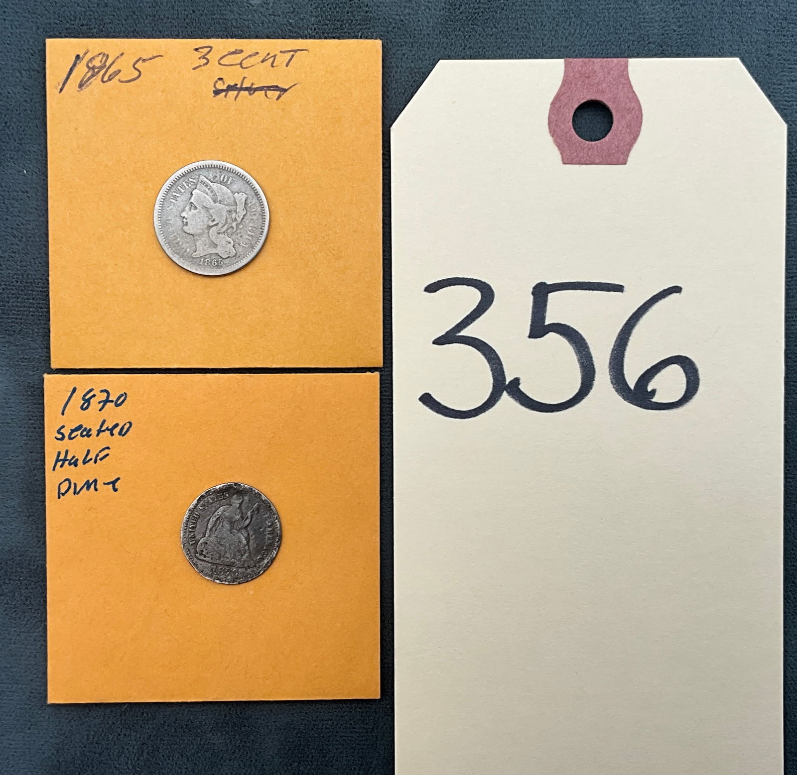 A Pair of US Coins, 1865 3-Cent Nickel and 1870 Silver Half Dime: This lot includes an 1865 Three-Cent Nickel (KM-95) and an 1870 Seated Liberty Half Dime (KM-91). The 1870 half dime is composed of .900 fine silver, while the 1865 piece is a copper-nickel alloy.