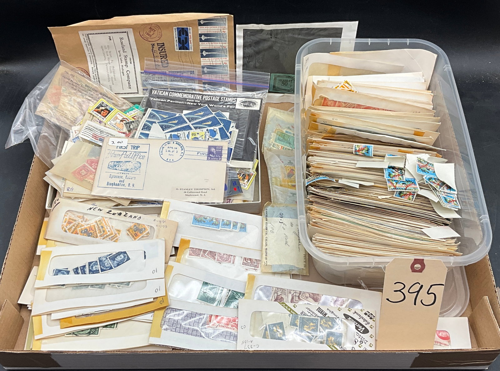 A Lot of Worldwide Stamps and Covers, US, FR, AU, NZ: This philatelic collection includes a US 1941 First Trip Highway Post Office commemorative cover and a Vatican 1964-1965 New York World's Fair set. The lot features a diverse range of worldwide