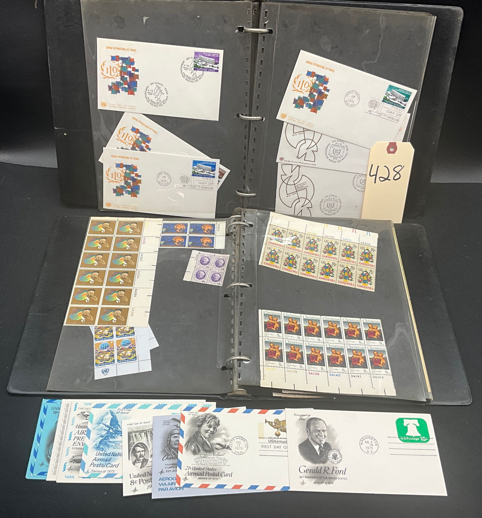 US and UN 1971-1976 Mint Stamp and FDC Collection in Binder: This philatelic assembly features a diverse range of US and UN commemoratives, including a full sheet of the 1976 Bicentennial State Flags (Scott #1633-1682) and a full sheet of the 1962 Dag Hammarskj