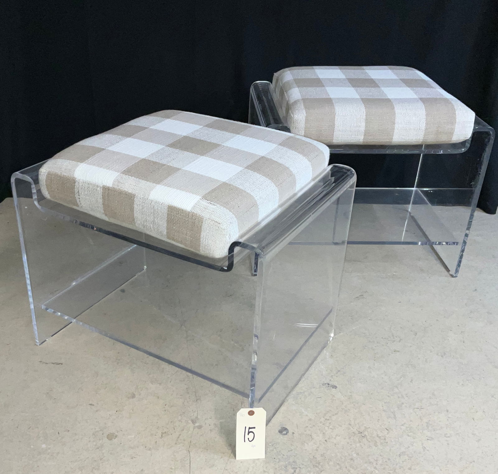 Contemporary Vanity Stools, Molded Acrylic, Gingham Check Cushions: This pair of contemporary vanity stools features clear molded acrylic frames with a minimalist waterfall silhouette and integrated lower storage shelves. Each stool is topped with a removable square c