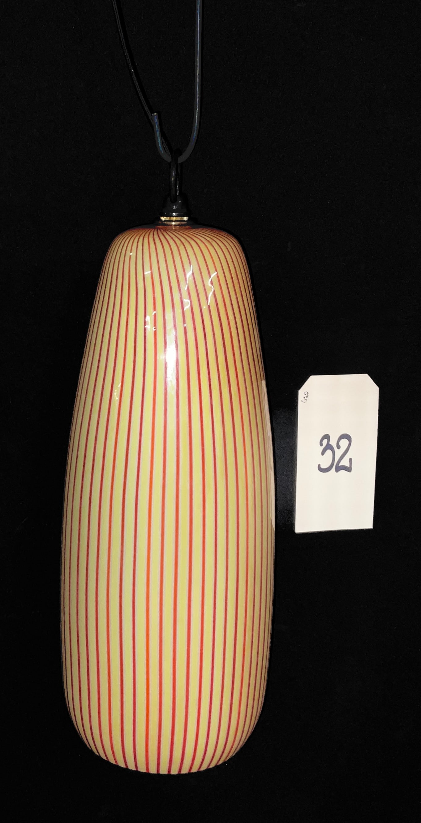 Mid-Century Modern Murano A Canne Glass Pendant Light Attributed to Massimo Vignelli for Venini: This mid-century modern hand-blown glass pendant light shade features an elongated, tapered cylindrical form characteristic of Italian Murano craftsmanship. The exterior is decorated with vertical red