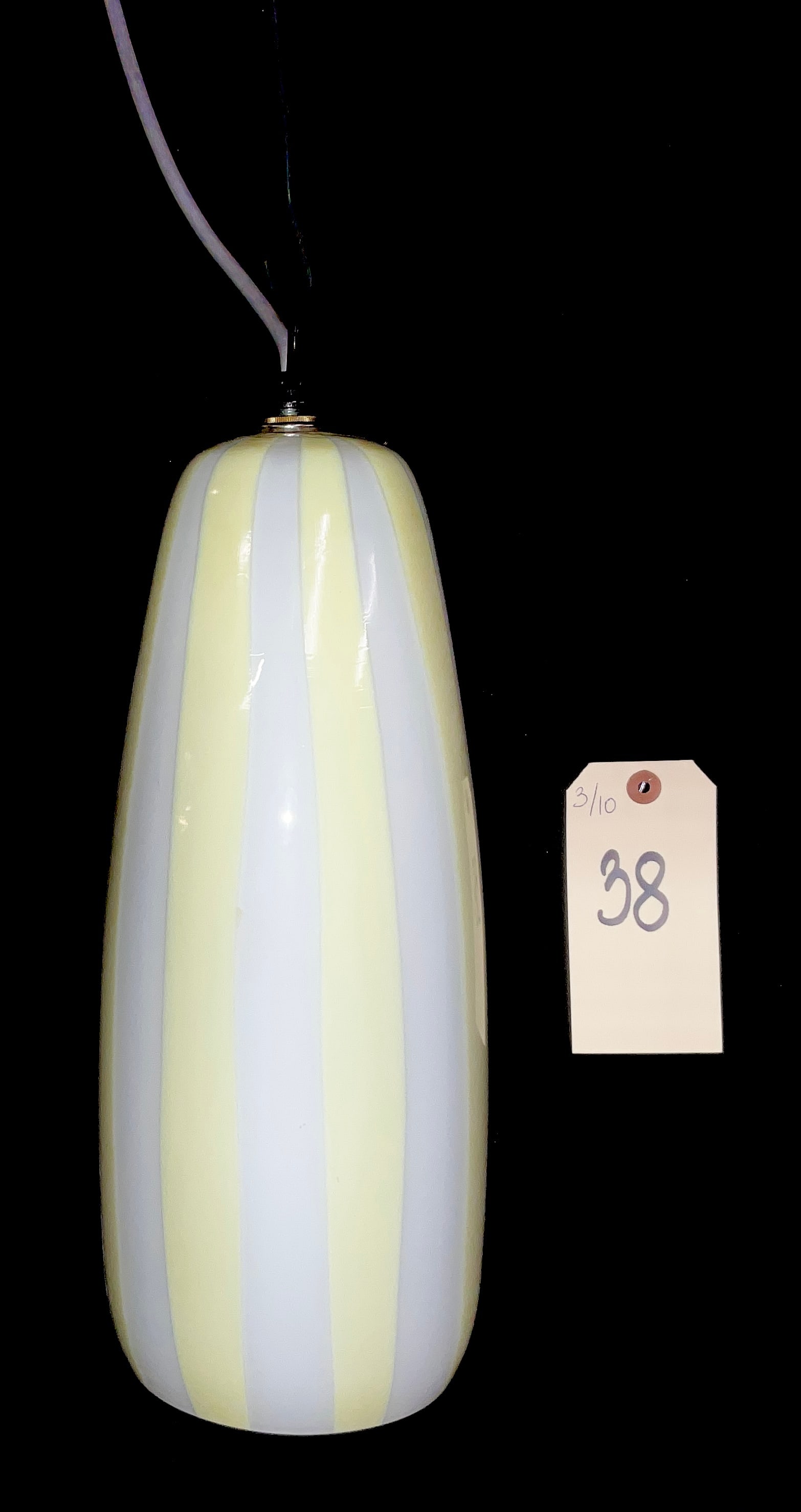 Massimo Vignelli for Venini Murano Glass Pendant Lamp, 1950s: This Mid-Century Modern Italian pendant light was designed by Massimo Vignelli for Venini during the 1950s. The elongated capsule-form shade is crafted from hand-blown glass featuring alternating vert