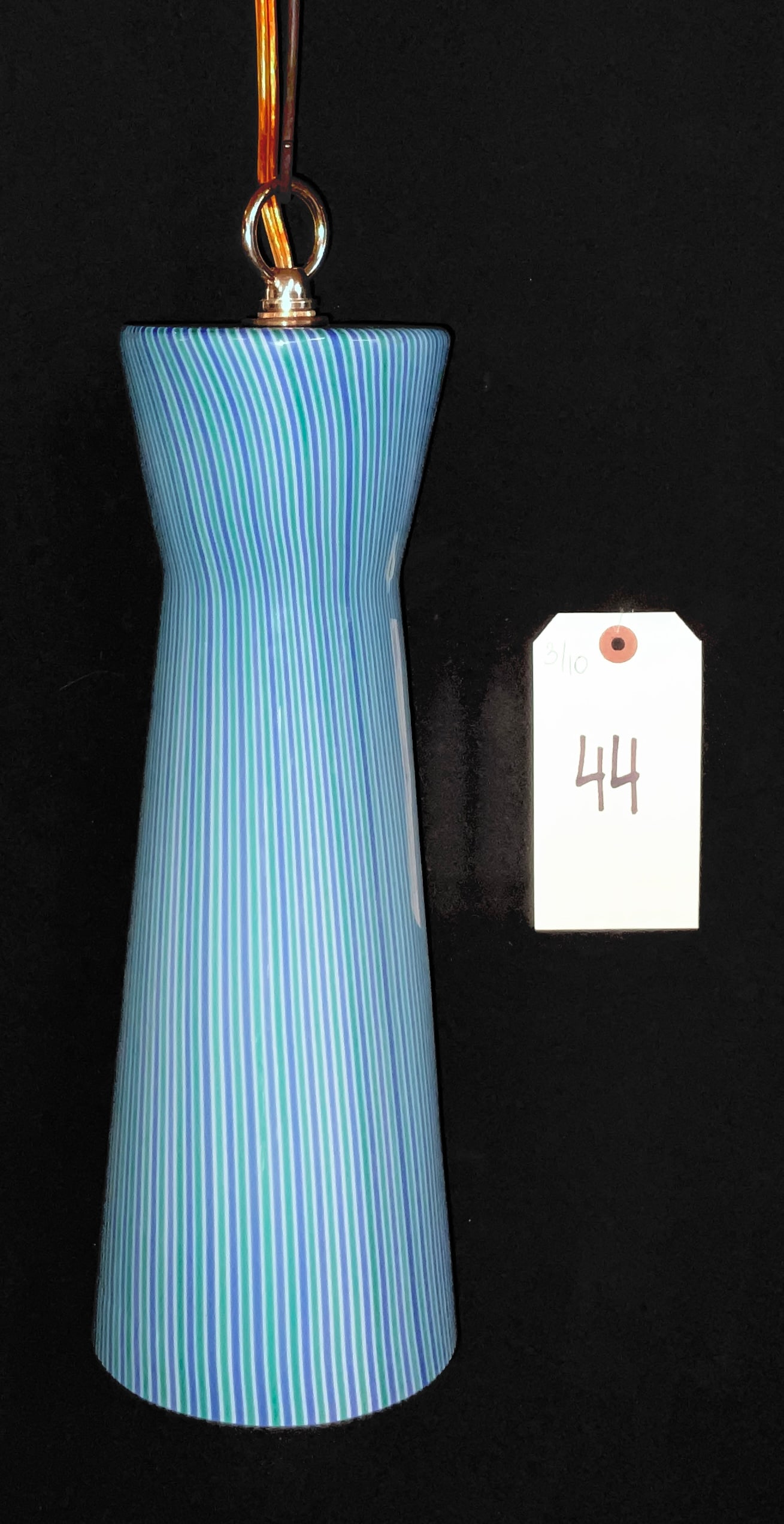 Venini Murano Art Glass Pendant Light, Mid-Century Modern Filigrana Pattern: This hand-blown Italian Murano art glass pendant light was crafted by Venini in a tapered cylindrical form with a flared top. The shade features a vibrant vertical filigrana pattern consisting of alte