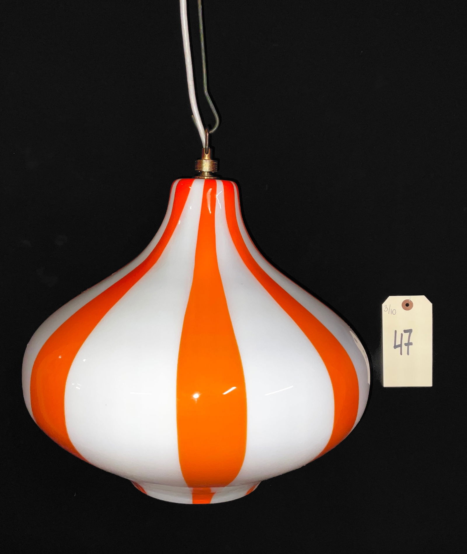 Massimo Vignelli for Venini Style Glass Pendant Lamp, 1960s Mid-Century Modern Orange and White: This mid-century modern pendant light features a bulbous cased glass shade with a bold pattern of alternating vertical orange and white stripes. Attributed to the "Cipolla" design by Massimo Vignelli