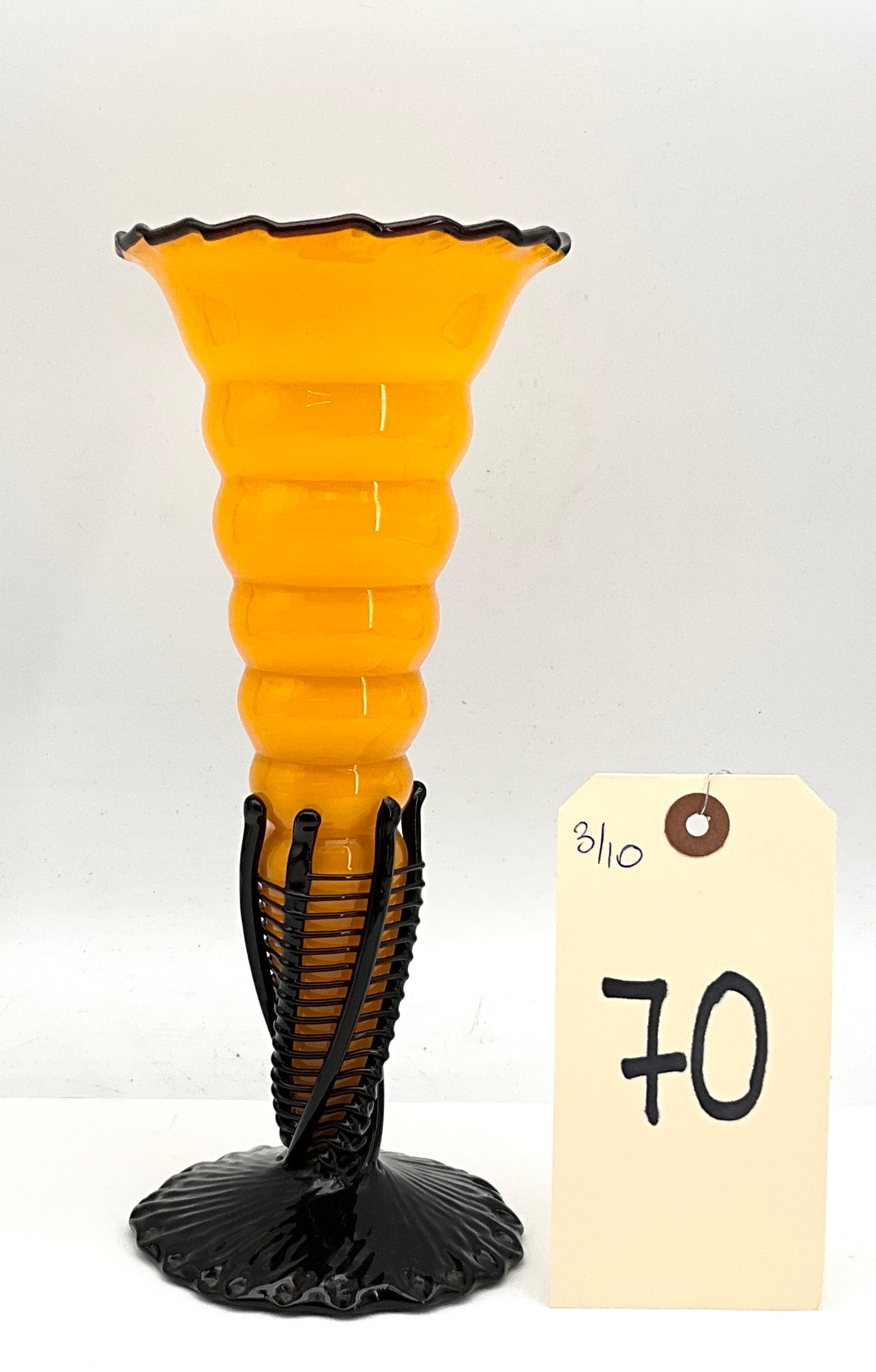 Czechoslovakian Tango Art Glass Beehive Vase in Black Glass Cage: This Art Deco period Czechoslovakian blown-glass vase is executed in the Tango style, featuring a vibrant yellow opaque body with a horizontal ribbed beehive texture. The vessel is encased in an appli