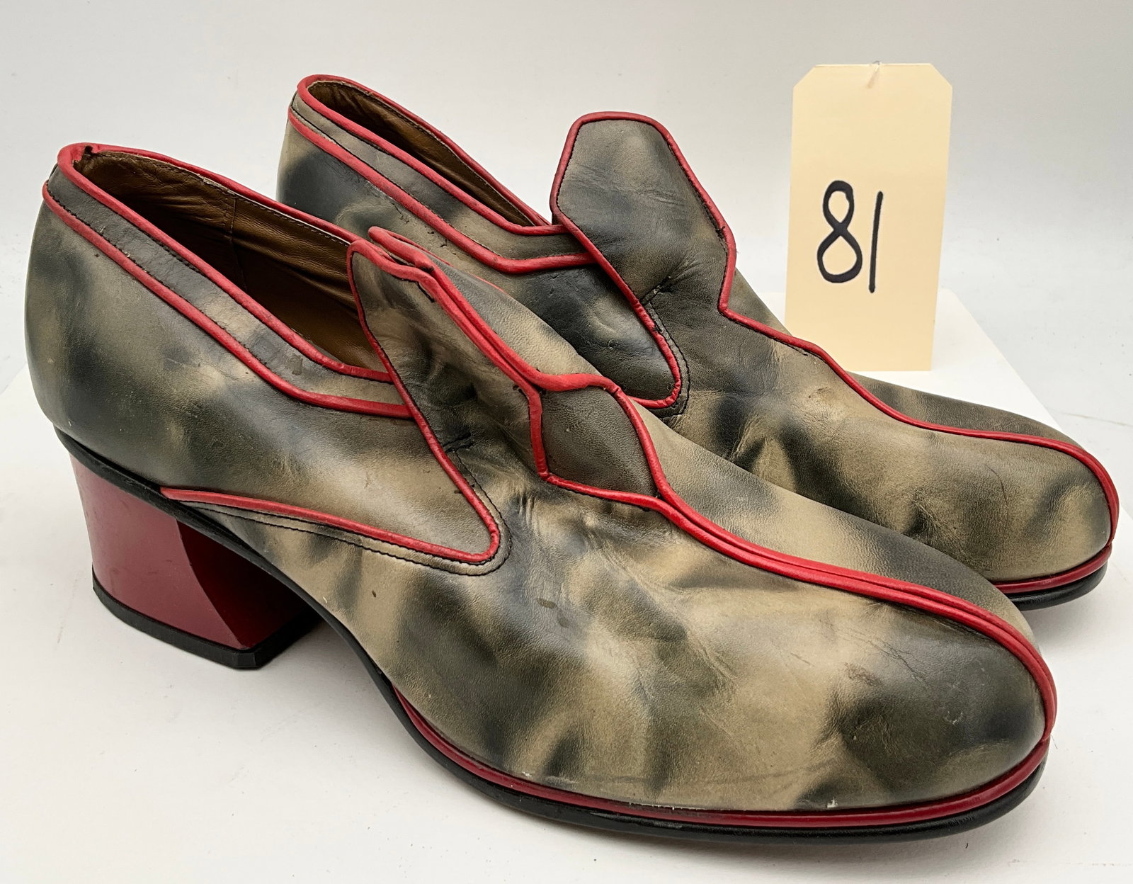 Vintage 1970s Milano Styled by Doua Men's Block-Heel Loafers: This pair of vintage men's loafers features mottled olive and gray smoky finished leather uppers accented by contrasting red piping and substantial red block heels. The interior is marked in gold Mila