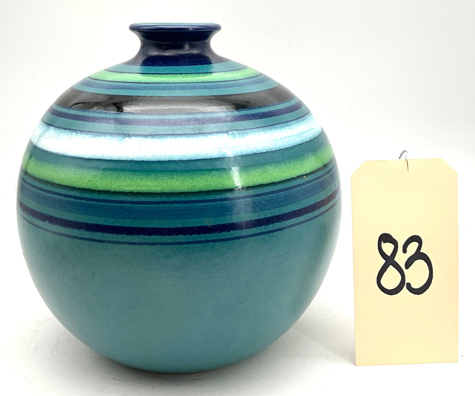 Aldo Londi for Bitossi Fascie Colorate Ceramic Vase for Rosenthal Netter: This spherical Mid-Century Modern studio pottery vase was designed by Aldo Londi for Bitossi and imported by Rosenthal Netter. The ceramic vessel features a high-gloss glaze decorated with vibrant con