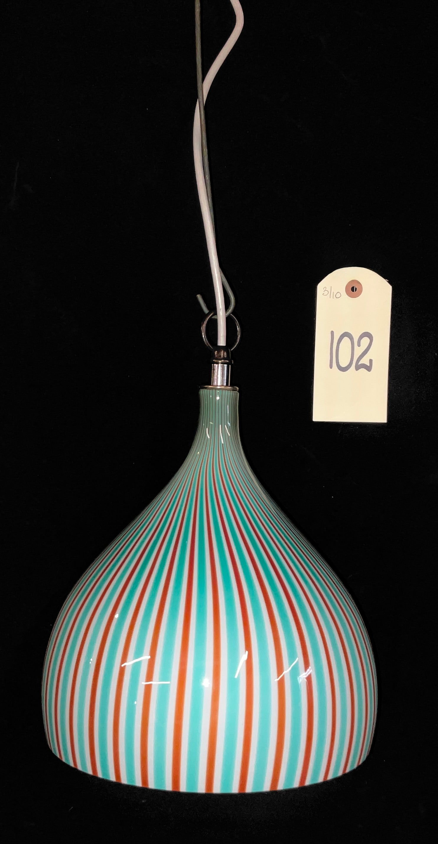 Massimo Vignelli for Venini Murano Art Glass Pendant Light: This Mid-century Modern pendant light was designed by Massimo Vignelli for Venini and features a teardrop-shaped Murano glass shade. The cased glass construction includes an opaque white interior with