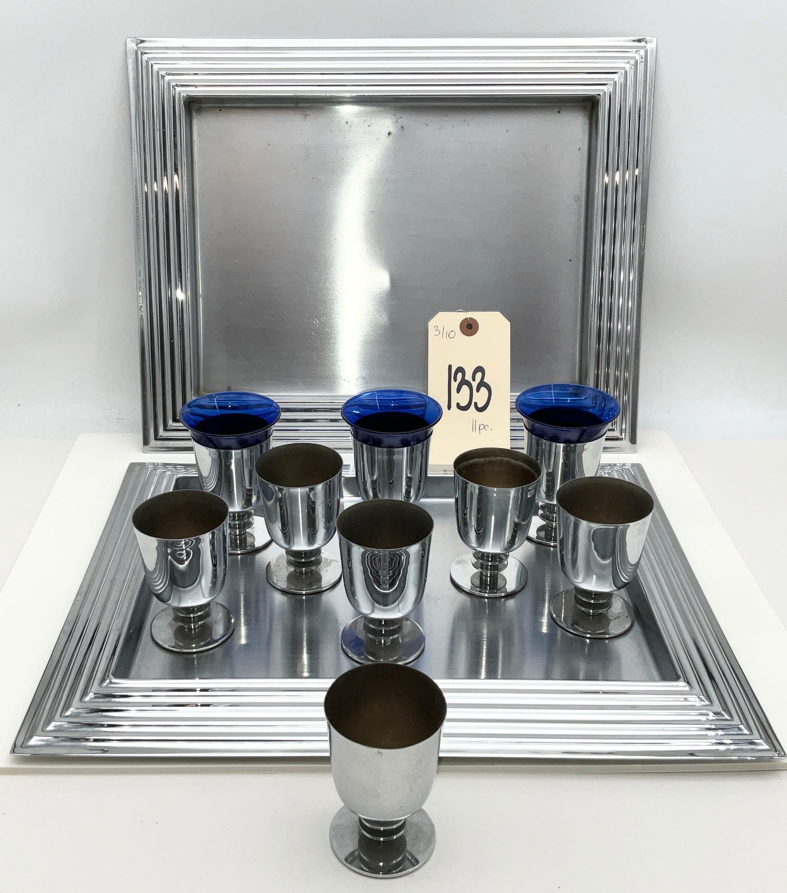Revere Copper and Brass Inc., Machine Age, 11-Piece Cocktail Set: Revere Copper and Brass Inc. of Rome, New York, manufactured this 11-piece Art Deco beverage set during the 1930s. The set includes two 14"x12" rectangular trays with tiered Machine Age borders and ni